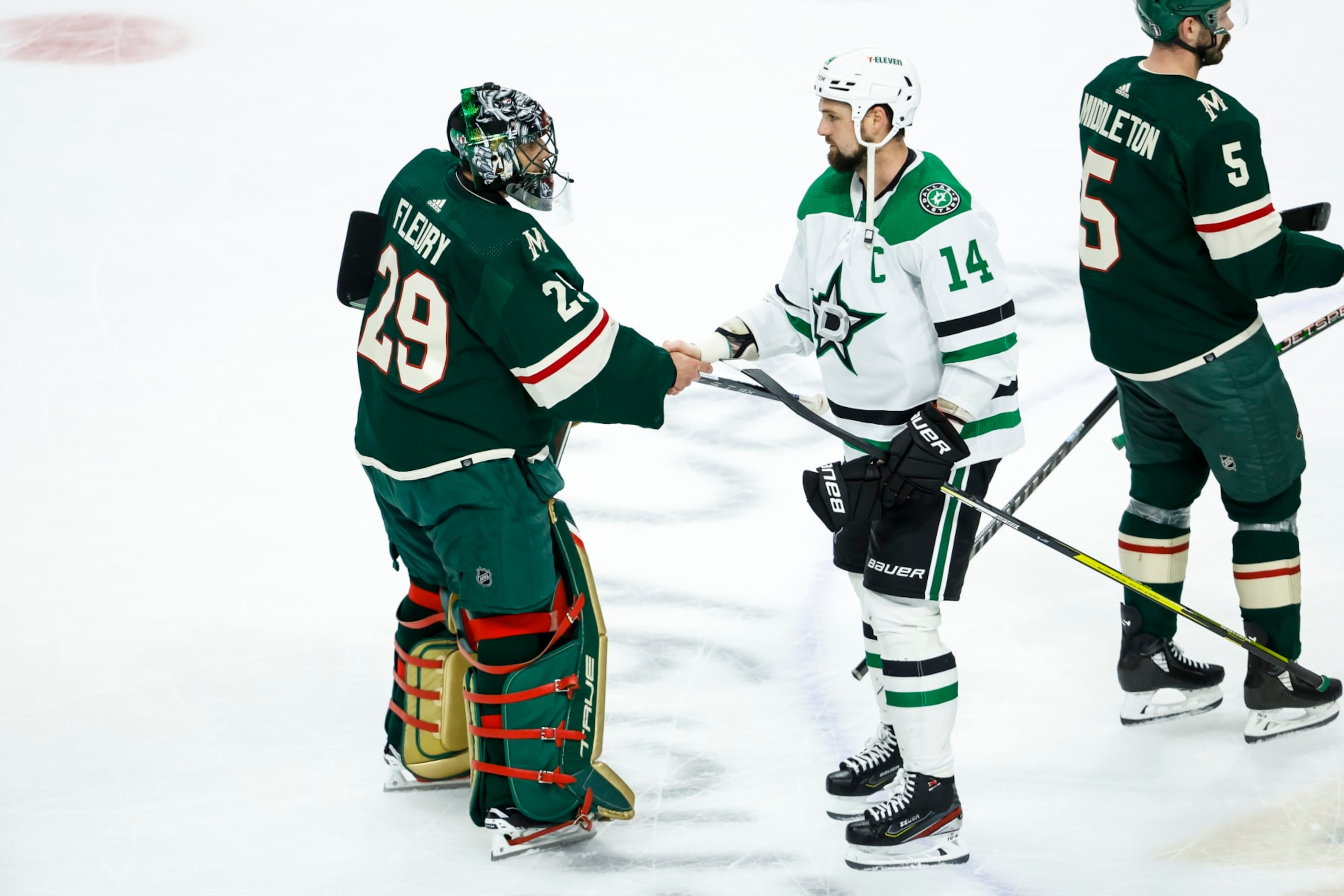 ST PAUL, MN - APRIL 28: Marc-Andre Fleury #29 of the Minnesota Wild and Jamie Benn #14 of the Dallas Stars shake hands after Game Six of the First Round of the 2023 Stanley Cup Playoffs at Xcel Energy Center on April 28, 2023 in St Paul, Minnesota. The Stars defeated the Wild 4-1 to advance to the Second Round. (Photo by David Berding/Getty Images) ST PAUL, MN - APRIL 28: Marc-Andre Fleury #29 of the Minnesota Wild and Jamie Benn #14 of the Dallas Stars shake hands after Game Six of the First Round of the 2023 Stanley Cup Playoffs at Xcel Energy Center on April 28, 2023 in St Paul, Minnesota. The Stars defeated the Wild 4-1 to advance to the Second Round. (Photo by David Berding/Getty Images)