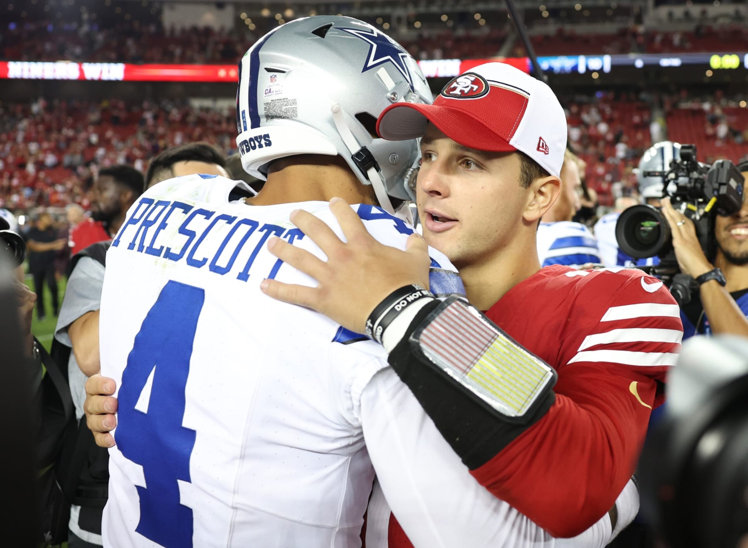 SANTA CLARA, CALIFORNIA - OCTOBER 08: Brock Purdy #13 of the San Francisco 49ers and Dak Prescott #4 of the Dallas Cowboys talk after their game at Levi's Stadium on October 08, 2023 in Santa Clara, California. (Photo by Ezra Shaw/Getty Images)