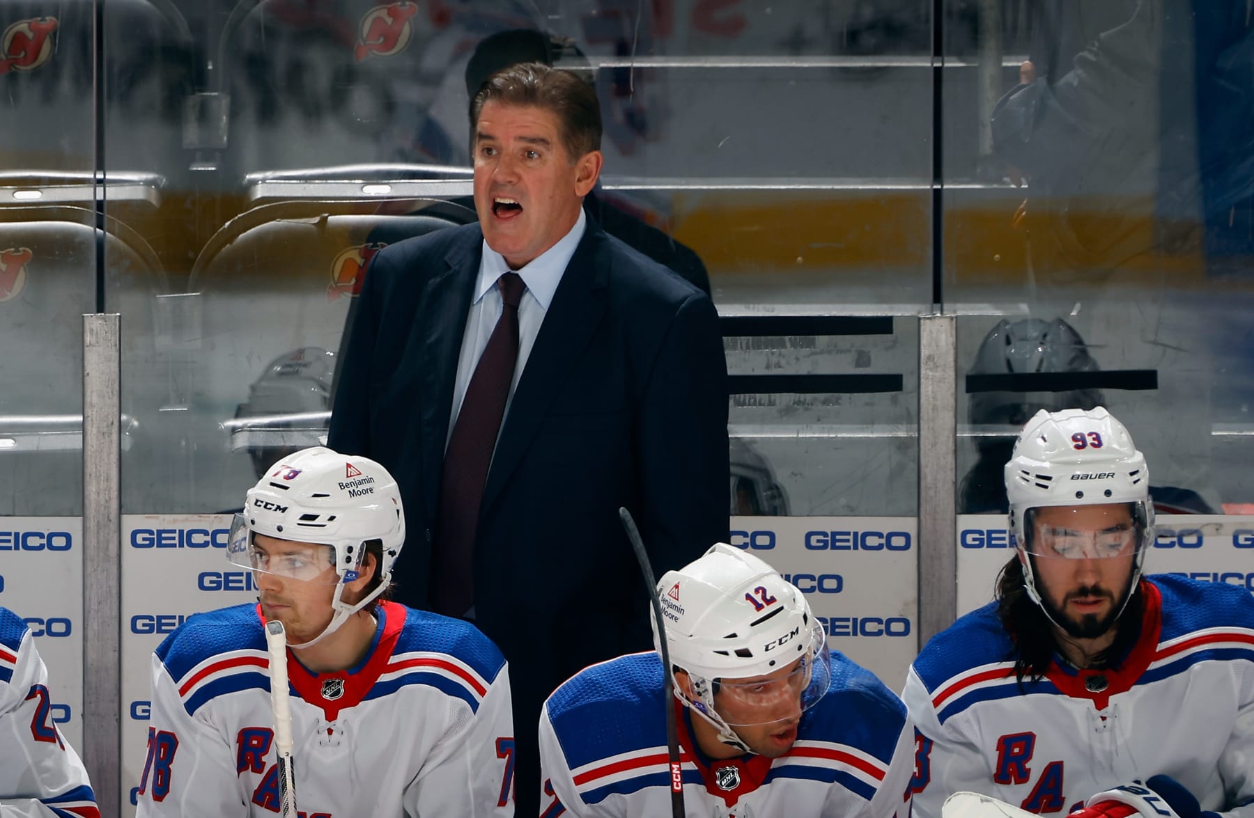 NEWARK, NEW JERSEY - OCTOBER 04: Head coach Peter Laviolette of New York Rangers handles the bench during the game against the New Jersey Devils  at Prudential Center on October 04, 2023 in Newark, New Jersey. (Photo by Bruce Bennett/Getty Images)