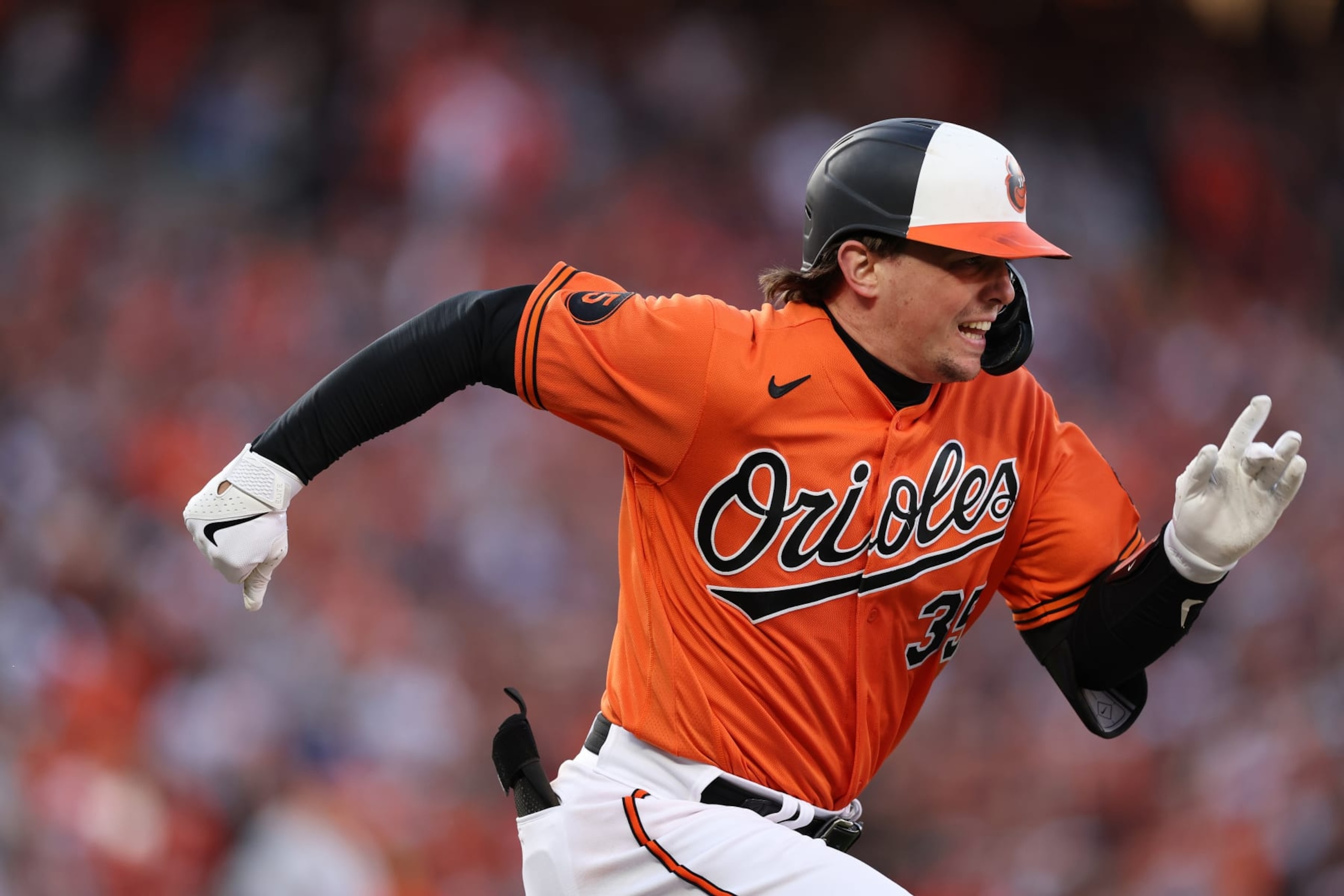 BALTIMORE, MARYLAND - OCTOBER 08: Adley Rutschman #35 of the Baltimore Orioles runs to first base against the Texas Rangers during Game Two of the American League Division Series at Oriole Park at Camden Yards on October 08, 2023 in Baltimore, Maryland. (Photo by Patrick Smith/Getty Images)
