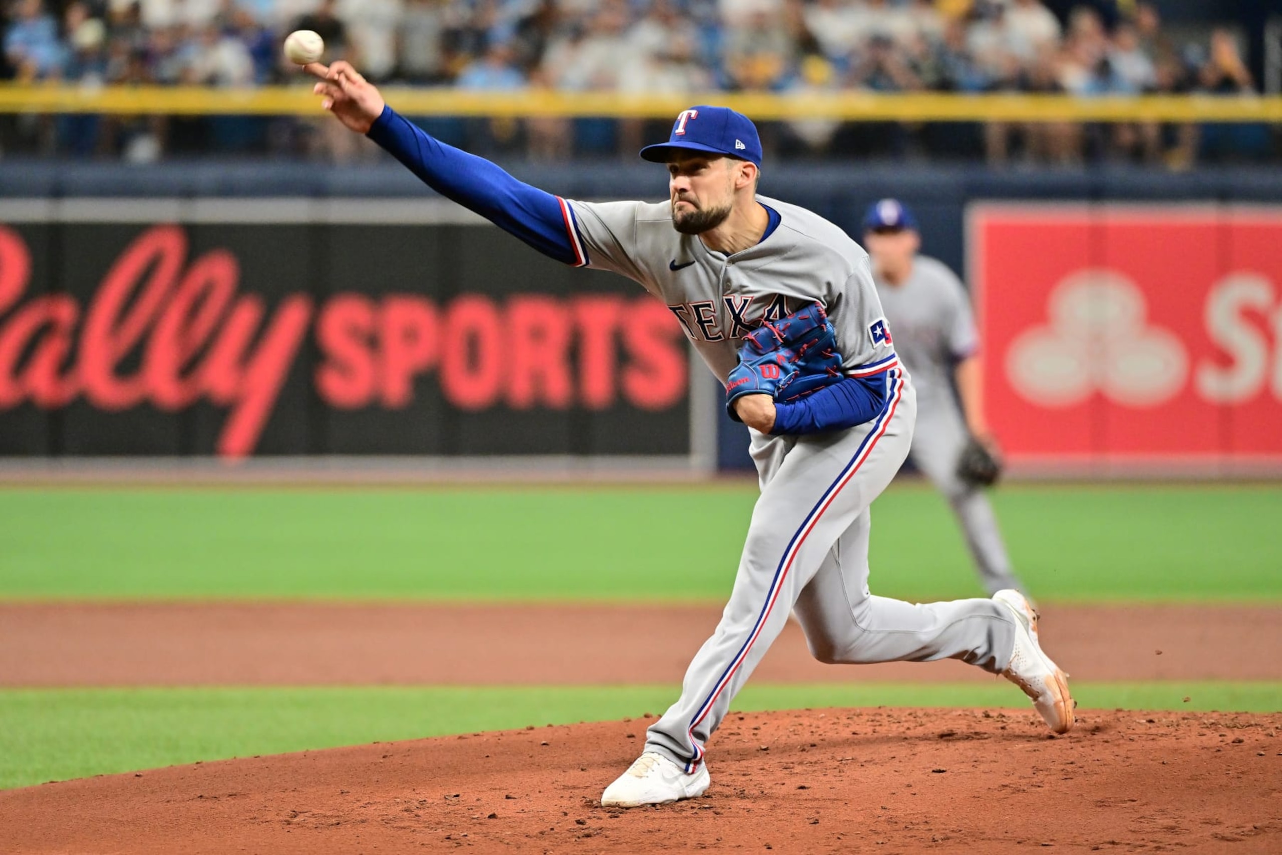 ST PETERSBURG, FLORIDA - OCTOBER 04: Nathan Eovaldi #17 of the Texas Rangers pitches against the Tampa Bay Rays in the first inning during Game Two of the Wild Card Series at Tropicana Field on October 04, 2023 in St Petersburg, Florida. (Photo by Julio Aguilar/Getty Images)