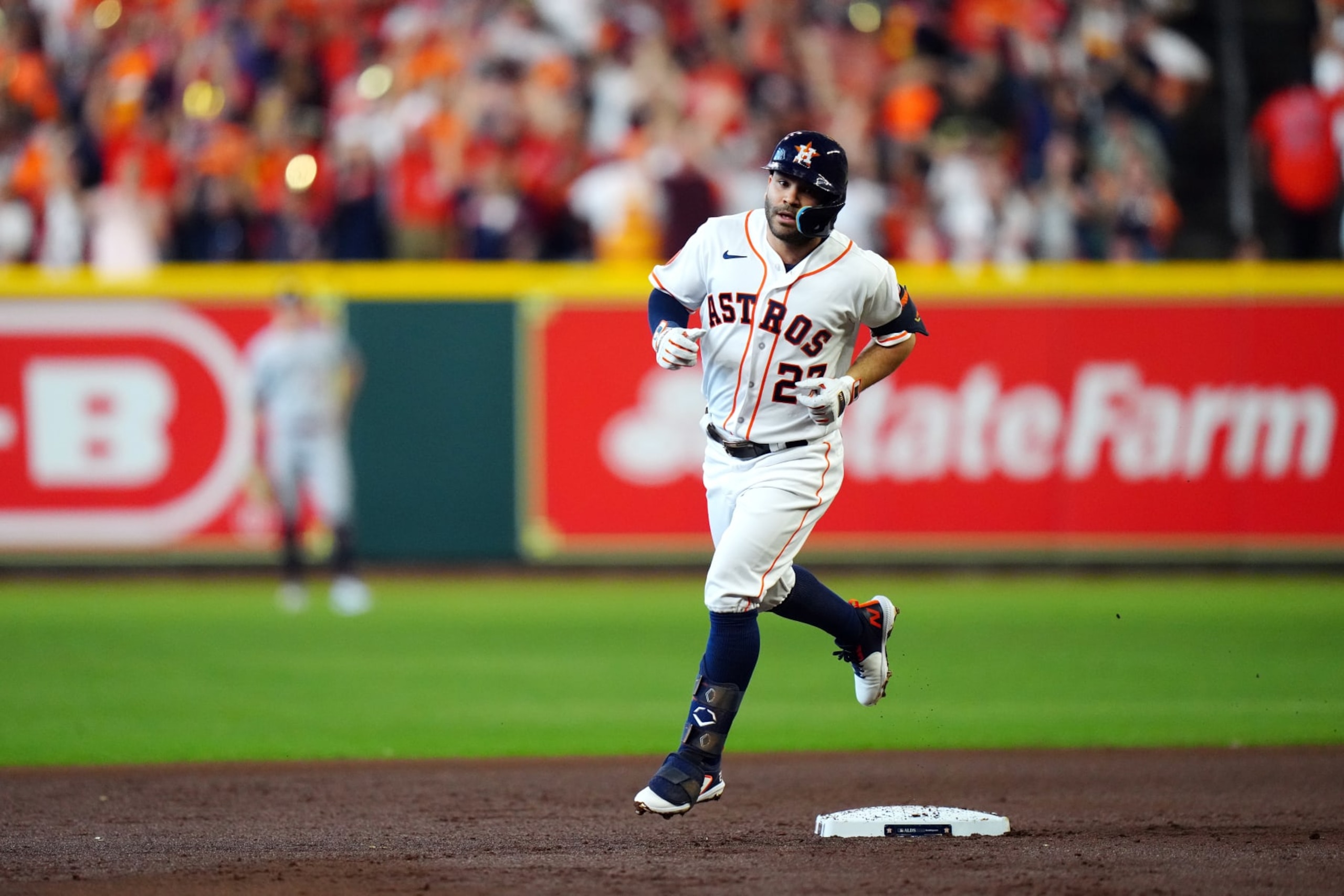 HOUSTON, TX - OCTOBER 07:  Jose Altuve #27 of the Houston Astros rounds the bases after hitting a solo home run in the first inning during Game 1 of the Division Series between the Minnesota Twins and the Houston Astros at Minute Maid Park on Saturday, October 7, 2023 in Houston, Texas. (Photo by Daniel Shirey/MLB Photos via Getty Images)
