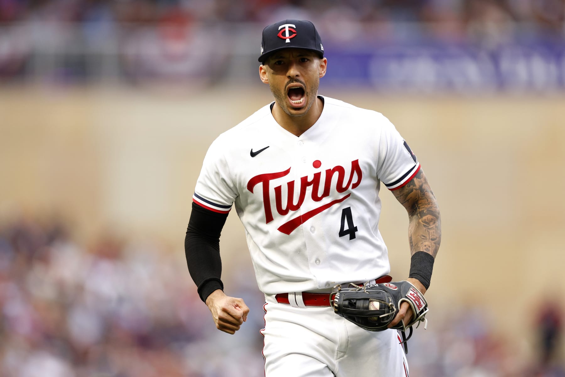 MINNEAPOLIS, MINNESOTA - OCTOBER 04: Carlos Correa #4 of the Minnesota Twins celebrates after tagging out Vladimir Guerrero Jr. #27 of the Toronto Blue Jays at second base during the fifth inning in Game Two of the Wild Card Series at Target Field on October 04, 2023 in Minneapolis, Minnesota. (Photo by David Berding/Getty Images)