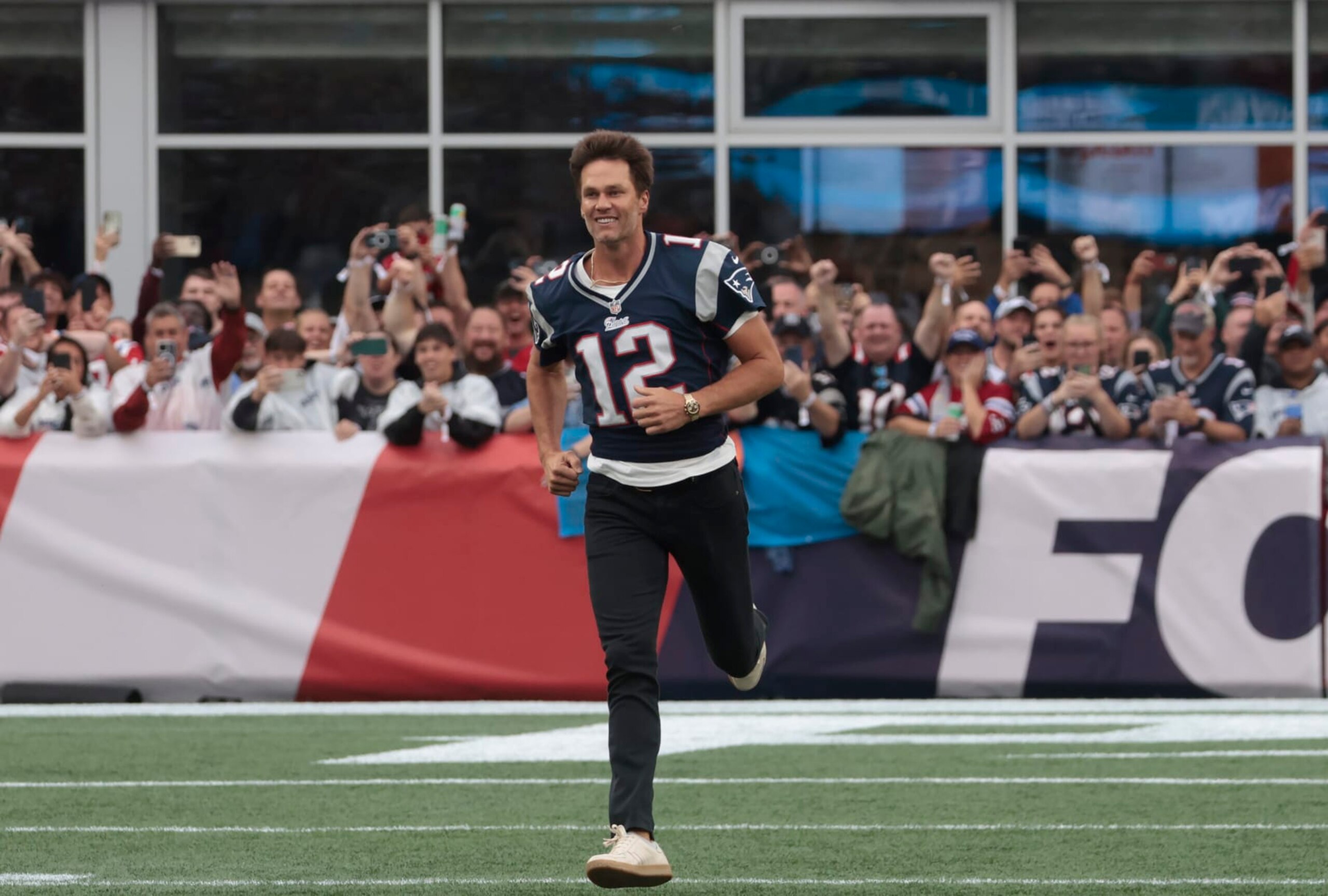 Foxborough, MA - September 10: Former New England Patriots QB Tom Brady runs out onto the field at halftime. The Patriots lost to the Philadelphia Eagles, 25-20. (Photo by Barry Chin/The Boston Globe via Getty Images)