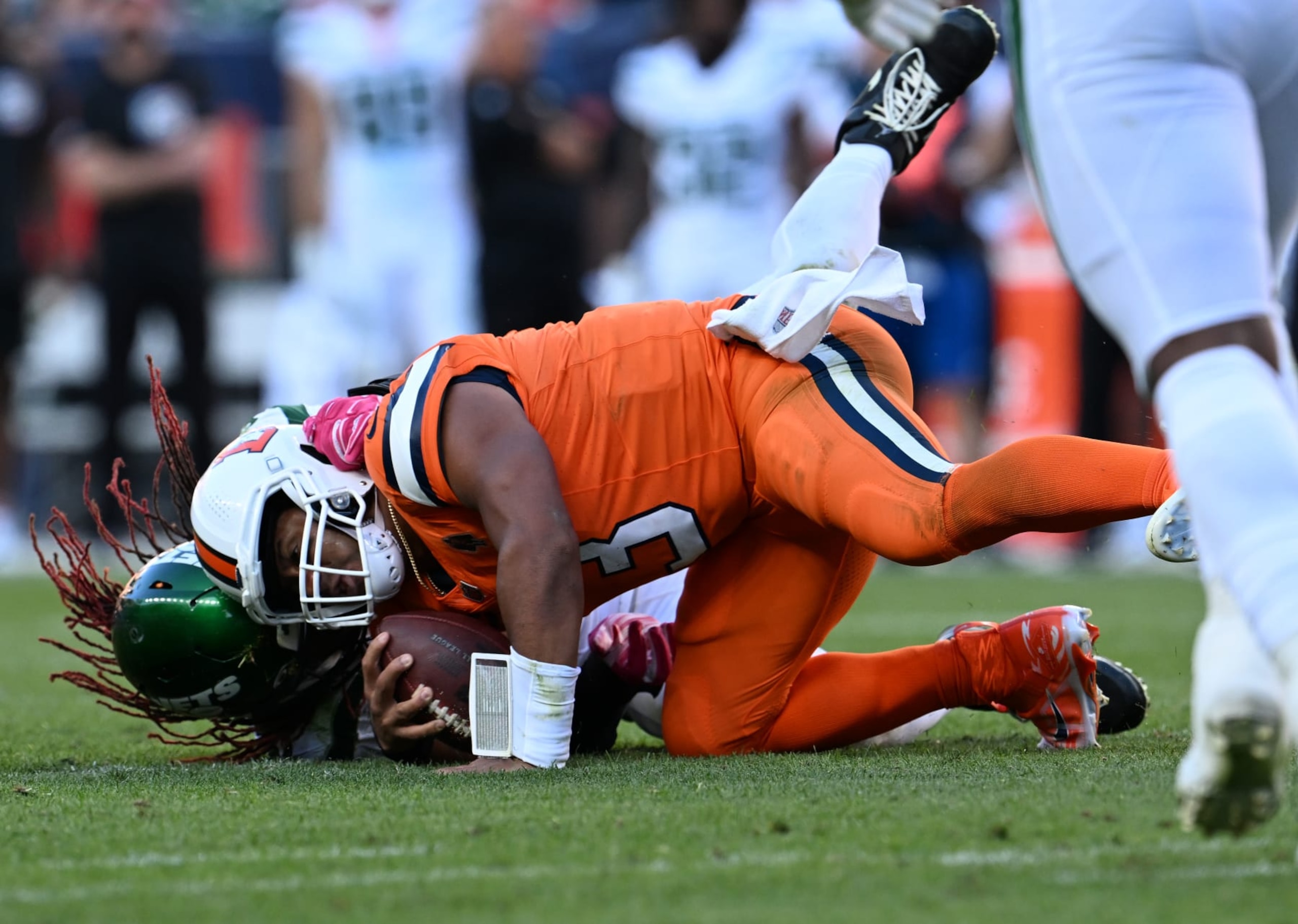 DENVER, COLORADO - OCTOBER 8: New York Jets linebacker C.J. Mosley (57) sacks Denver Broncos quarterback Russell Wilson (3) late in the game on October 8, 2023 in Denver, Colorado. The Denver Broncos lost 31 to 21 to the New York Jets at Empower Field at Mile High during week 5 of the NFL season. (Photo by RJ Sangosti/MediaNews Group/The Denver Post via Getty Images)