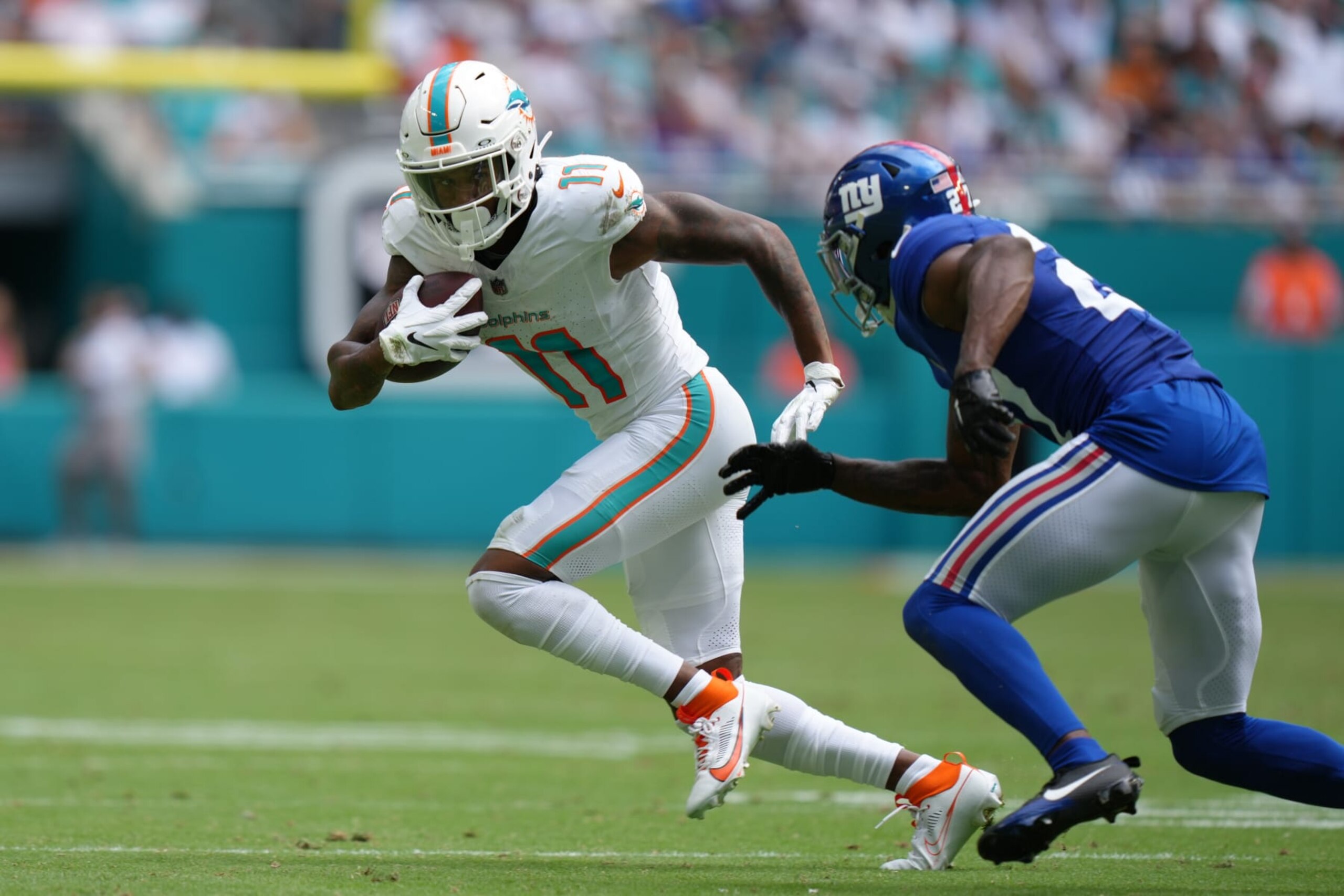 MIAMI GARDENS, FL - OCTOBER 08: Miami Dolphins wide receiver Cedrick Wilson Jr. (11) runs after a catch as New York Giants safety Jason Pinnock (27) during the game between the New York Giants and the Miami Dolphins on Sunday, October 8, 2023 at Hard Rock Stadium, Miami Gardens, Fla. (Photo by Peter Joneleit/Icon Sportswire via Getty Images)