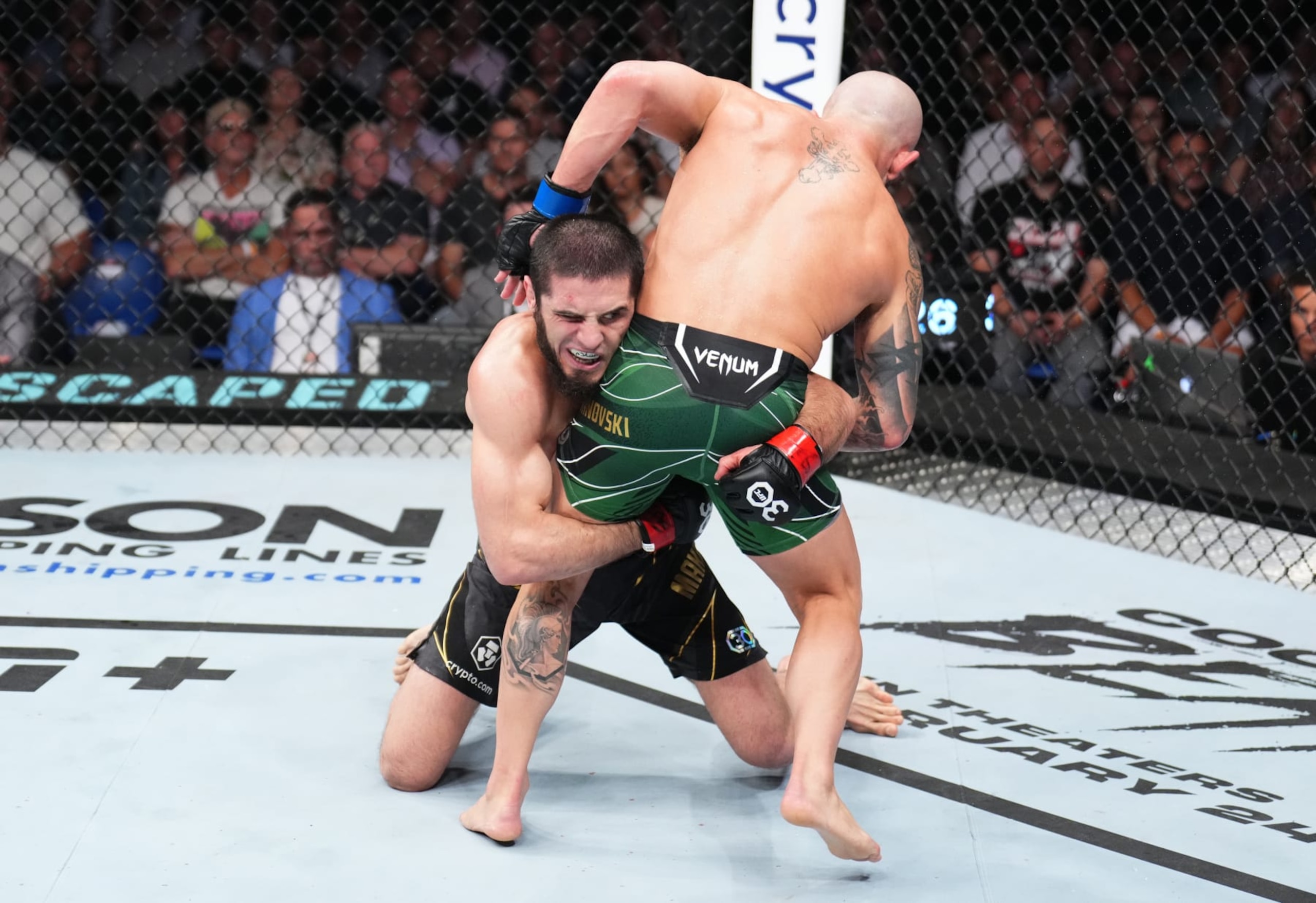 PERTH, AUSTRALIA - FEBRUARY 12: (L-R) Islam Makhachev of Russia shoots for a takedown against Alexander Volkanovski of Australia in the UFC lightweight championship fight during the UFC 284 event at RAC Arena on February 12, 2023 in Perth, Australia. (Photo by Chris Unger/Zuffa LLC via Getty Images)