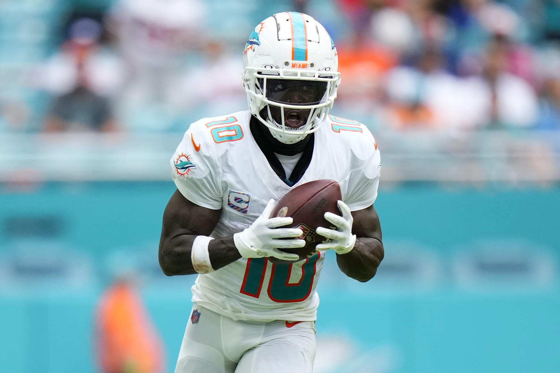 MIAMI GARDENS, FLORIDA - OCTOBER 08: Tyreek Hill #10 of the Miami Dolphins runs the ball against the New York Giants during the third quarter at Hard Rock Stadium on October 08, 2023 in Miami Gardens, Florida. (Photo by Rich Storry/Getty Images)