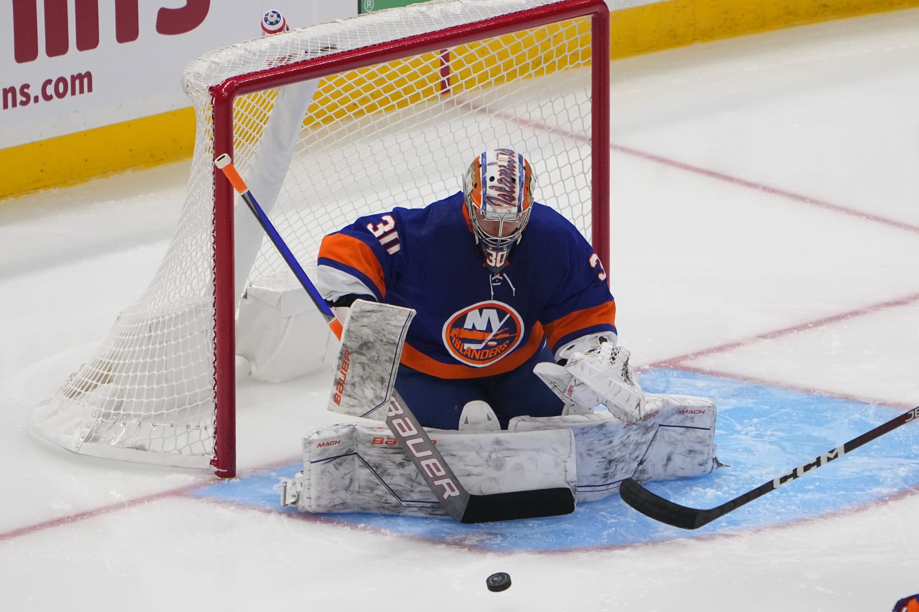 ELMONT, NY - OCTOBER 06: New York Islanders Goalie Ilya Sorokin (30) covers the puck during the second period of the National Hockey League preseason game between the New Jersey Devils and the New York Islanders on October 6, 2023, at UBS Arena in Elmont, NY. (Photo by Gregory Fisher/Icon Sportswire via Getty Images)