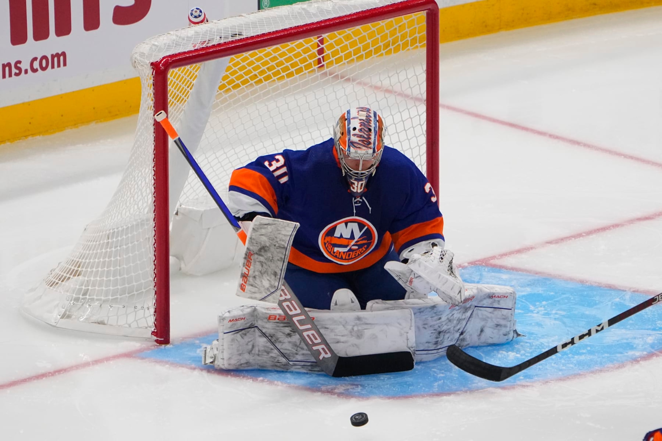 ELMONT, NY - OCTOBER 06: New York Islanders Goalie Ilya Sorokin (30) covers the puck during the second period of the National Hockey League preseason game between the New Jersey Devils and the New York Islanders on October 6, 2023, at UBS Arena in Elmont, NY. (Photo by Gregory Fisher/Icon Sportswire via Getty Images)