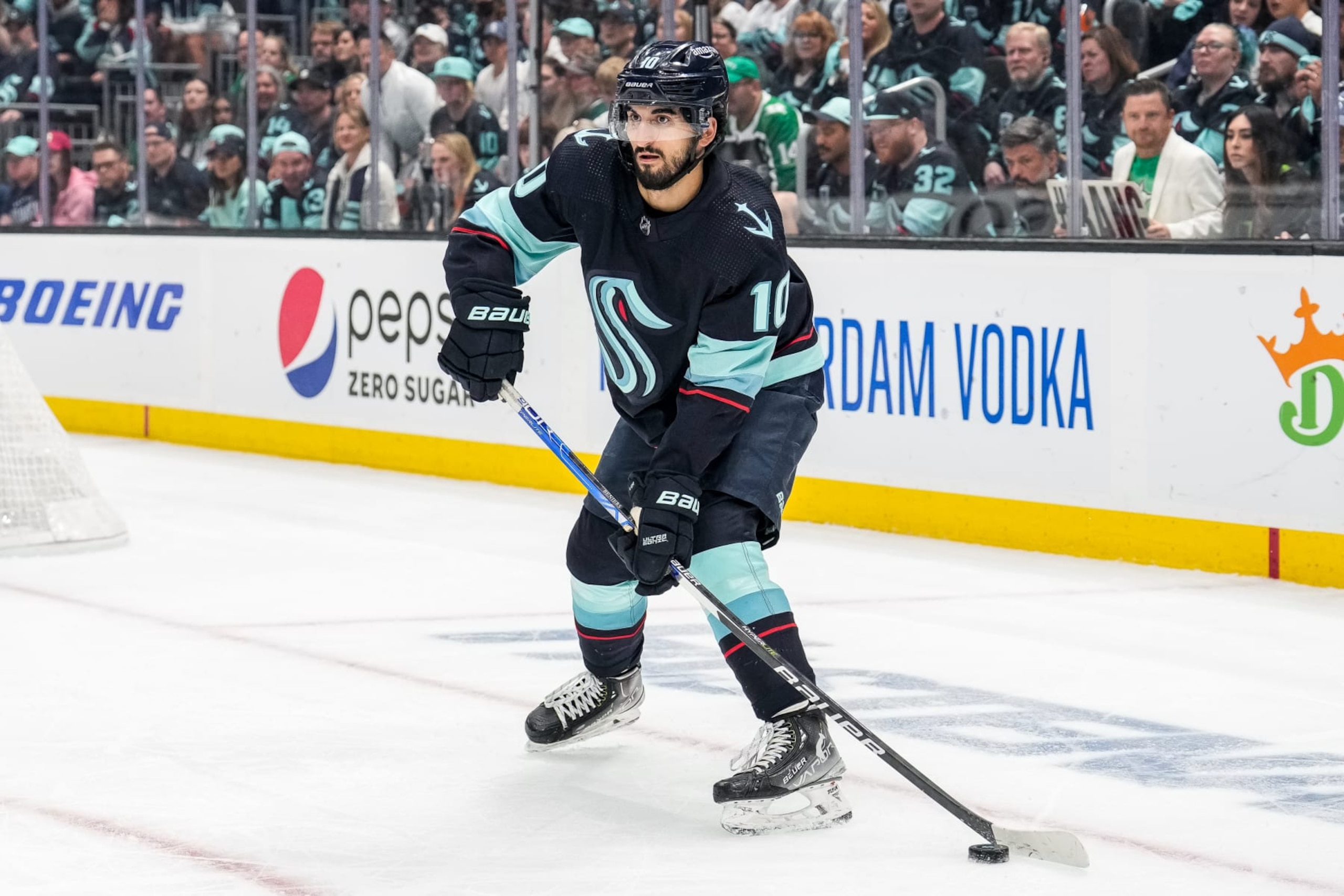 SEATTLE, WASHINGTON - MAY 12: Matty Beniers #10 of the Seattle Kraken skates with the puck during the second period against the Dallas Stars in Game Six of the Second Round of the 2023 Stanley Cup Playoffs at Climate Pledge Arena on May 12, 2023 in Seattle, Washington. (Photo by Christopher Mast/NHLI via Getty Images)