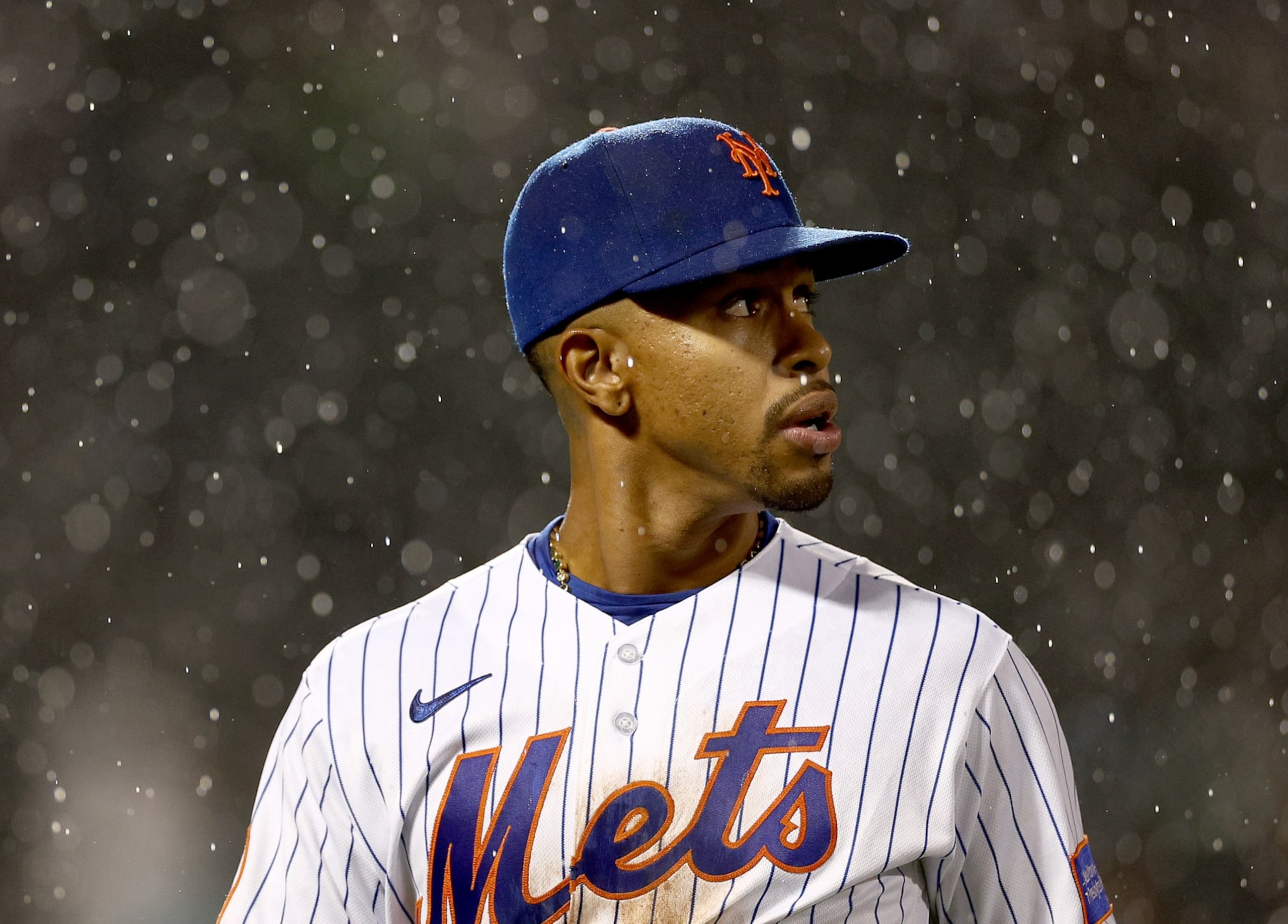 NEW YORK, NEW YORK - SEPTEMBER 28:  Francisco Lindor #12 of the New York Mets heads back to the dugout as the game is in a delay in the top of the ninth inning against the Miami Marlins at Citi Field on September 28, 2023 in the Flushing neighborhood of the Queens borough of New York City. (Photo by Elsa/Getty Images)