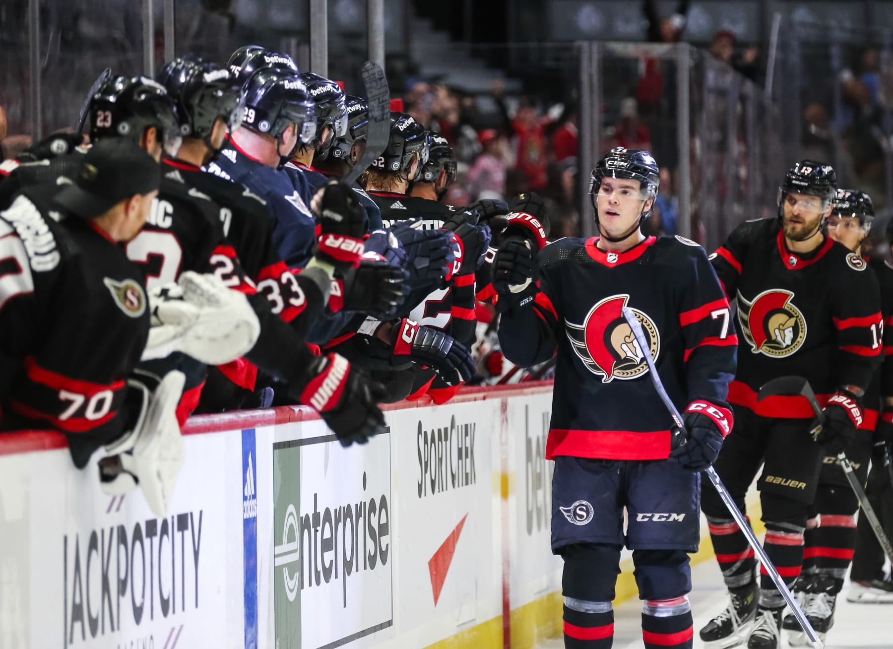 OTTAWA, CANADA - OCTOBER 07: Ridly Greig #71 of the Ottawa Senators celebrates his third period of a preseason game goal against the Montreal Canadiens with his teammates on the bench at Canadian Tire Centre on October 07, 2023 in Ottawa, Canada. (Photo by Chris Tanouye/Freestyle Photography/Getty Images)