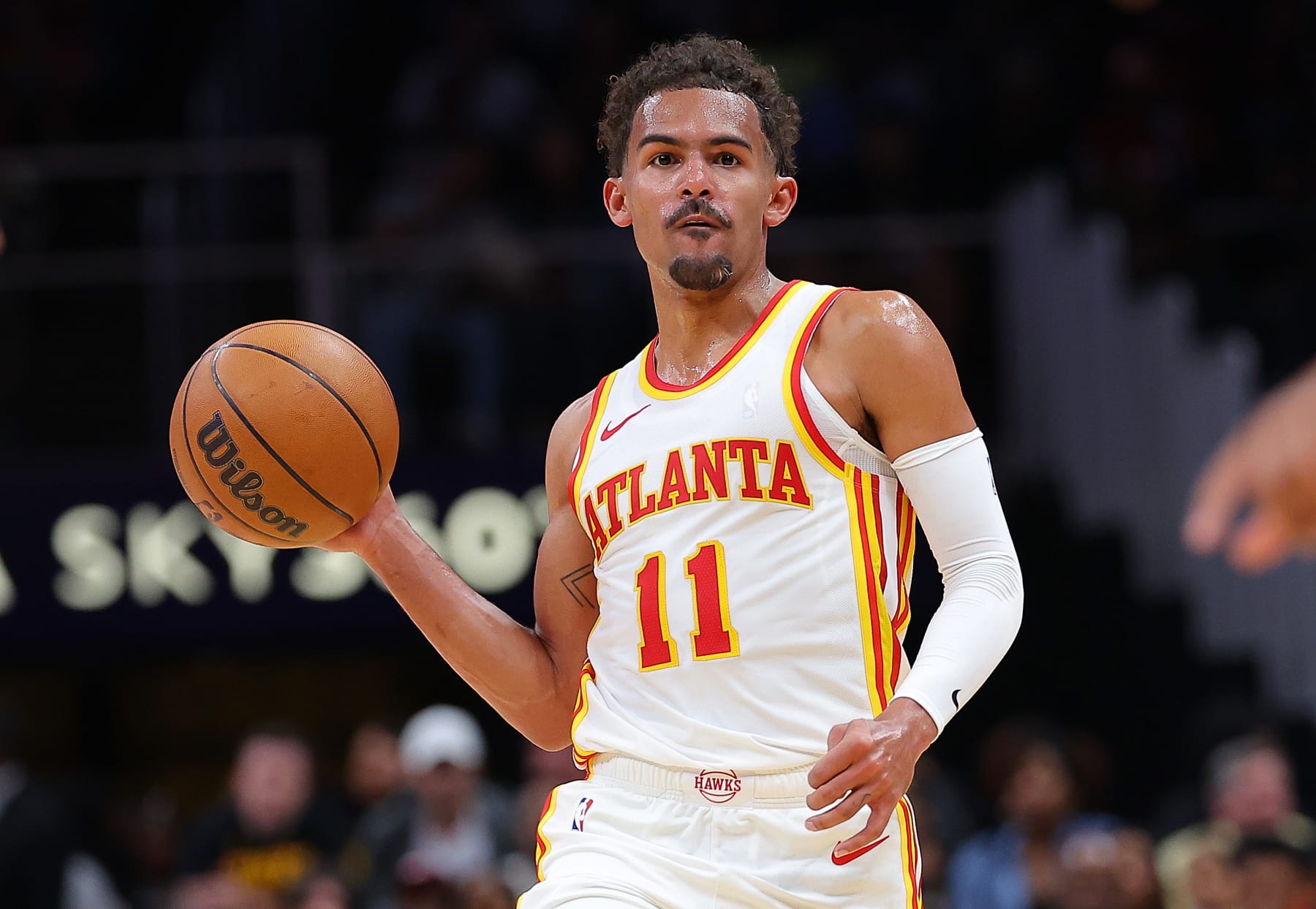 ATLANTA, GEORGIA - OCTOBER 10:  Trae Young #11 of the Atlanta Hawks looks to pass against the Cleveland Cavaliers during the second quarter at State Farm Arena on October 10, 2023 in Atlanta, Georgia.  NOTE TO USER: User expressly acknowledges and agrees that, by downloading and/or using this photograph, user is consenting to the terms and conditions of the Getty Images License Agreement.  (Photo by Kevin C. Cox/Getty Images)