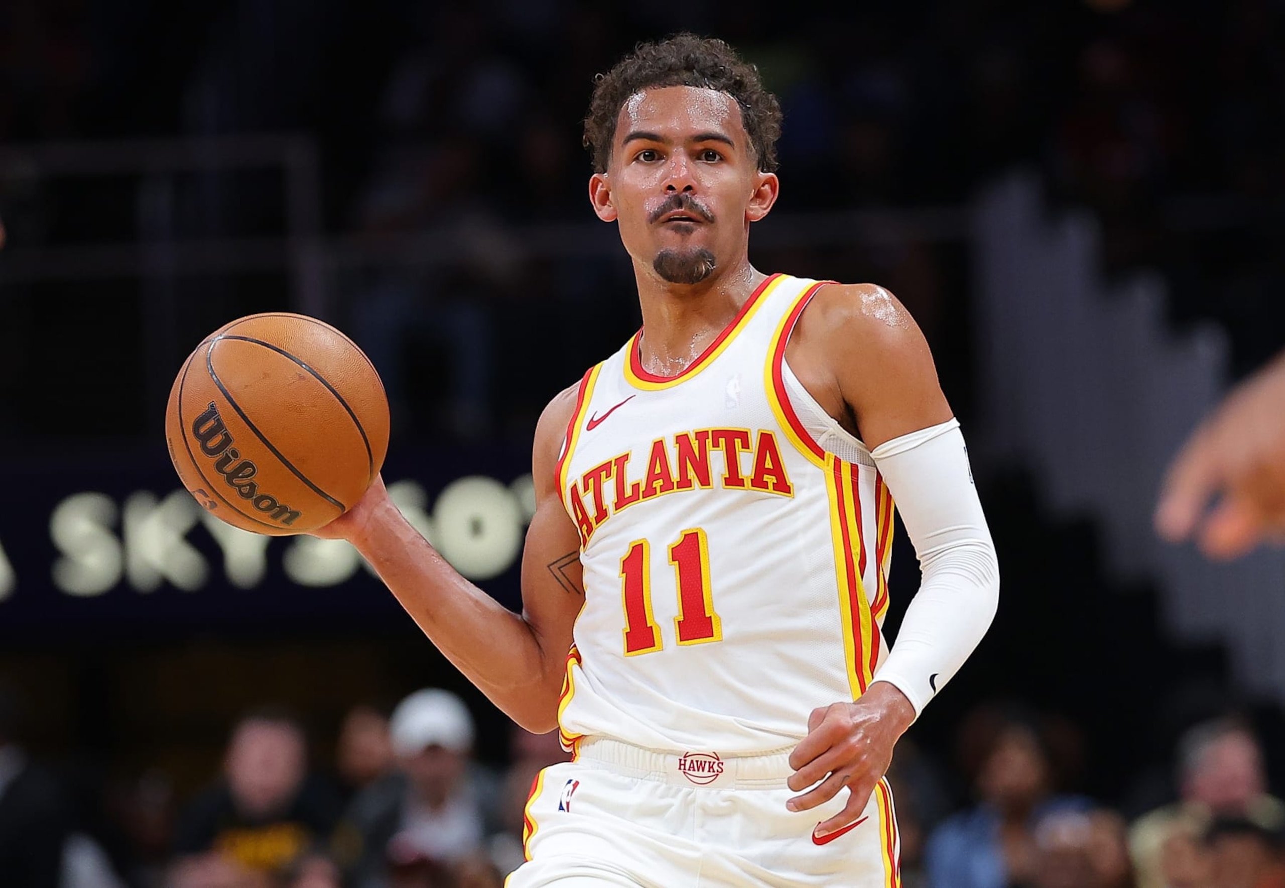 ATLANTA, GEORGIA - OCTOBER 10:  Trae Young #11 of the Atlanta Hawks looks to pass against the Cleveland Cavaliers during the second quarter at State Farm Arena on October 10, 2023 in Atlanta, Georgia.  NOTE TO USER: User expressly acknowledges and agrees that, by downloading and/or using this photograph, user is consenting to the terms and conditions of the Getty Images License Agreement.  (Photo by Kevin C. Cox/Getty Images)