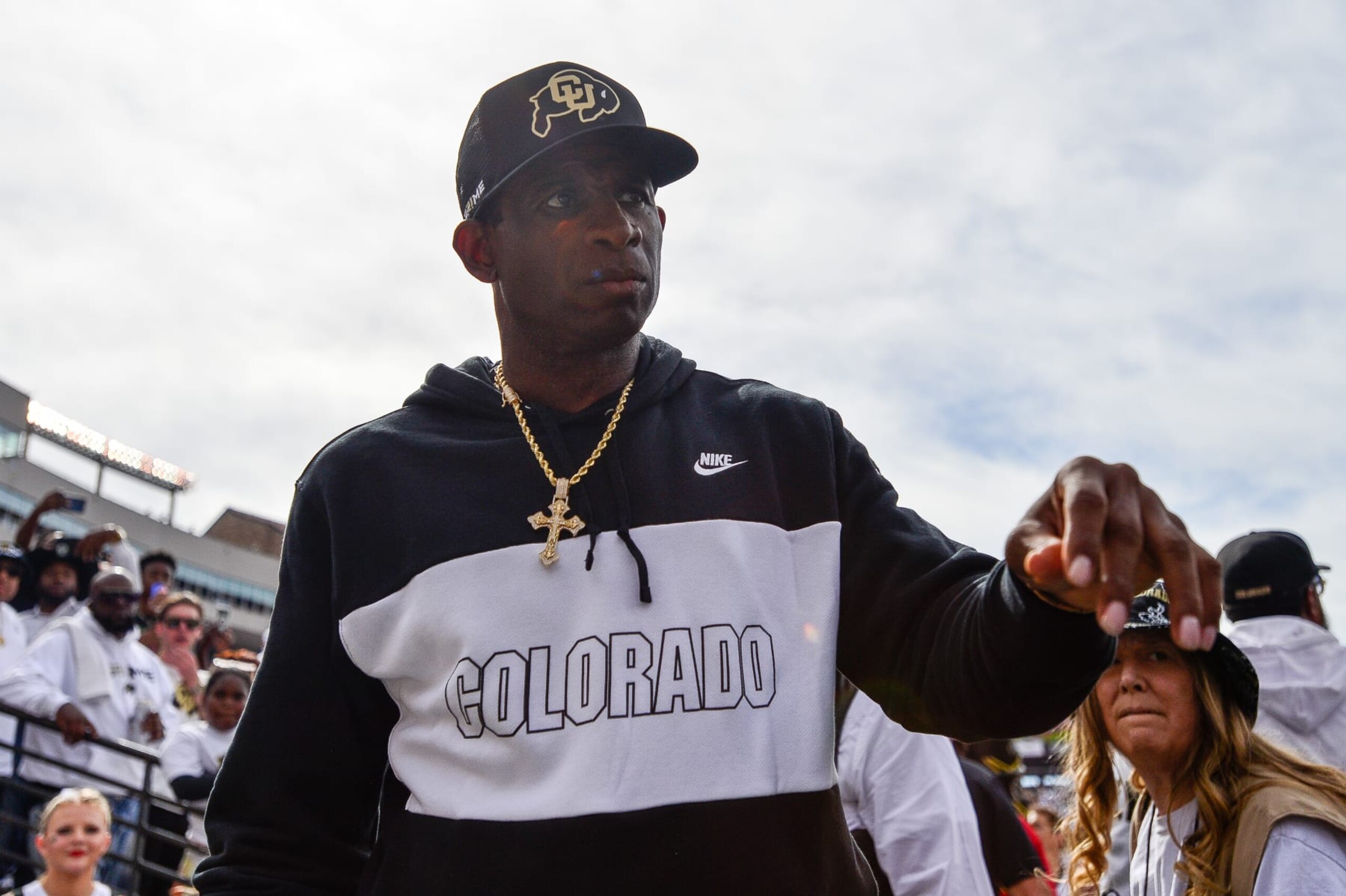 BOULDER, CO - SEPTEMBER 30:  Head coach Deion Sanders of the Colorado Buffaloes walks off the field at halftime of a game against the USC Trojans at Folsom Field on September 30, 2023 in Boulder, Colorado. (Photo by Dustin Bradford/Getty Images)