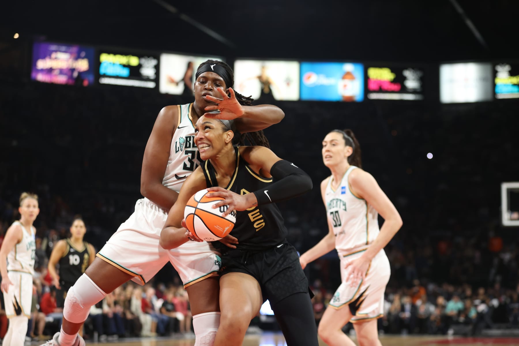 LAS VEGAS, NV - OCTOBER 11: A'ja Wilson #22 of the Las Vegas Aces drives to the basket during Game 2 of the 2023 WNBA Finals on October 11, 2023 at the Michelob ULTRA Arena in Las Vegas, Nevada. NOTE TO USER: User expressly acknowledges and agrees that, by downloading and or using this photograph, User is consenting to the terms and conditions of the Getty Images License Agreement. Mandatory Copyright Notice: Copyright 2023 NBAE (Photo by Ian Maule/NBAE via Getty Images)