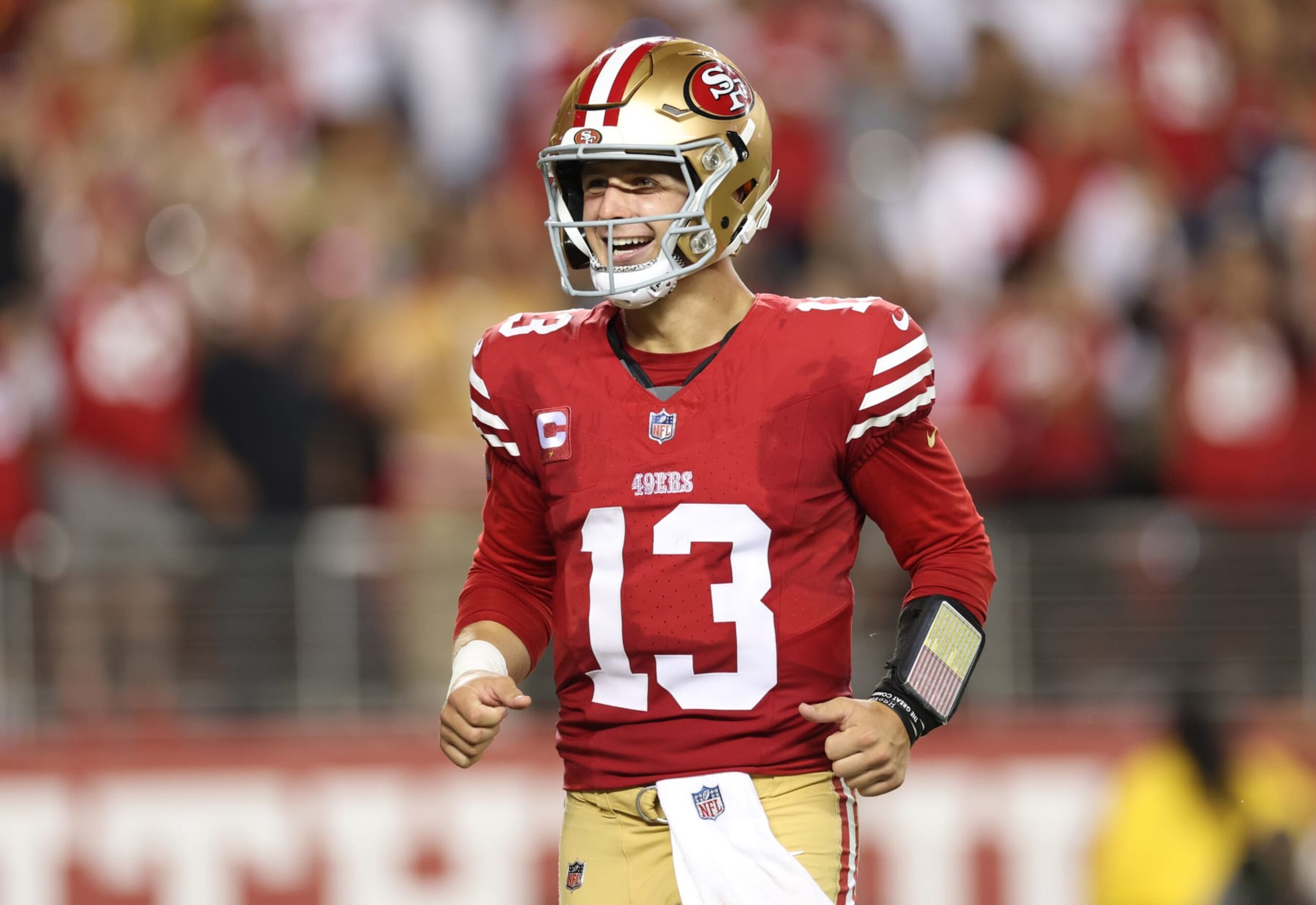SANTA CLARA, CALIFORNIA - OCTOBER 08: Brock Purdy #13 of the San Francisco 49ers reacts after a touchdown by Jordan Mason #24 during the fourth quarter against the Dallas Cowboys at Levi's Stadium on October 08, 2023 in Santa Clara, California. (Photo by Ezra Shaw/Getty Images)