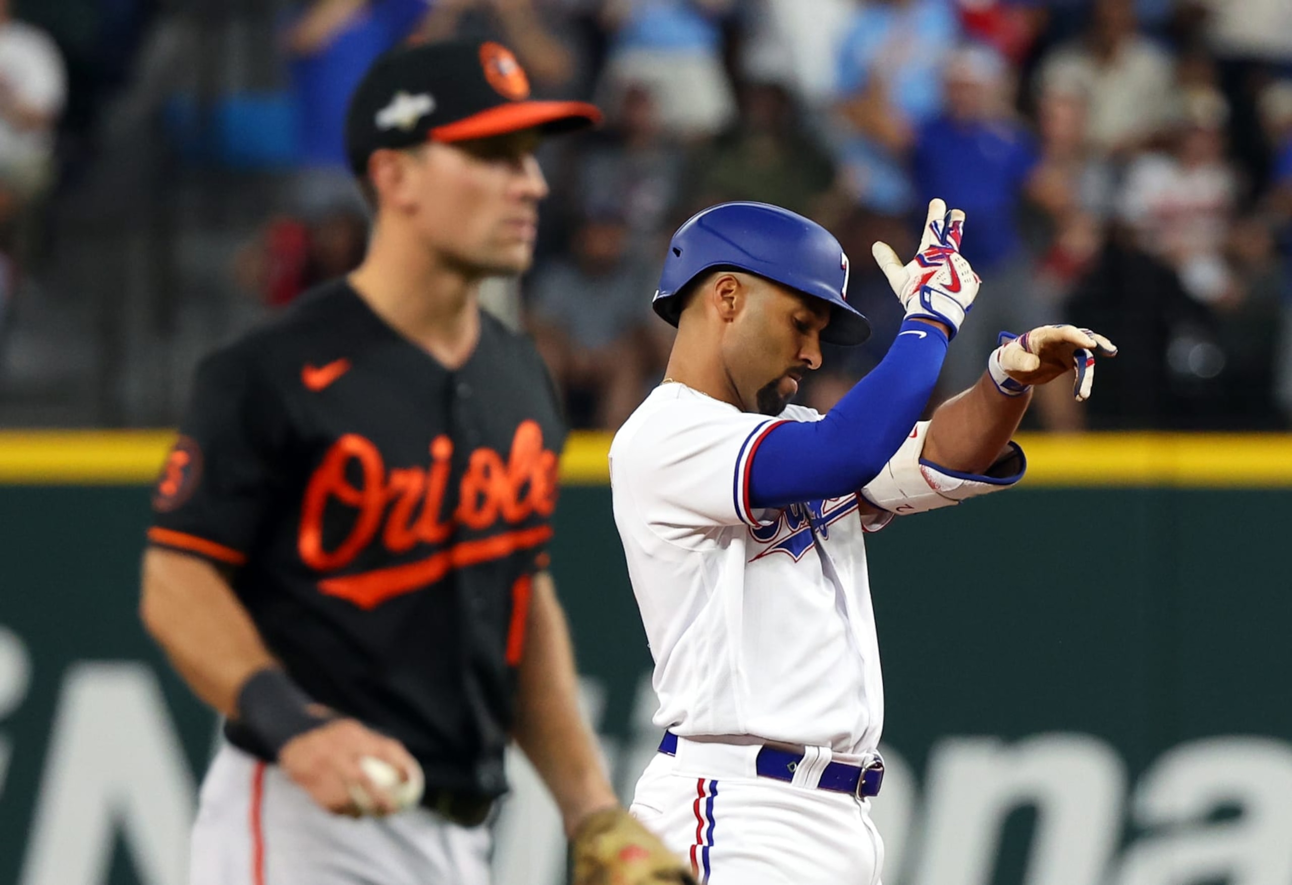ARLINGTON, TEXAS - OCTOBER 10: Marcus Semien #2 of the Texas Rangers gestures to the dugout after hitting a double against the Baltimore Orioles in the second inning during Game Three of the Division Series at Globe Life Field on October 10, 2023 in Arlington, Texas. (Photo by Richard Rodriguez/Getty Images)