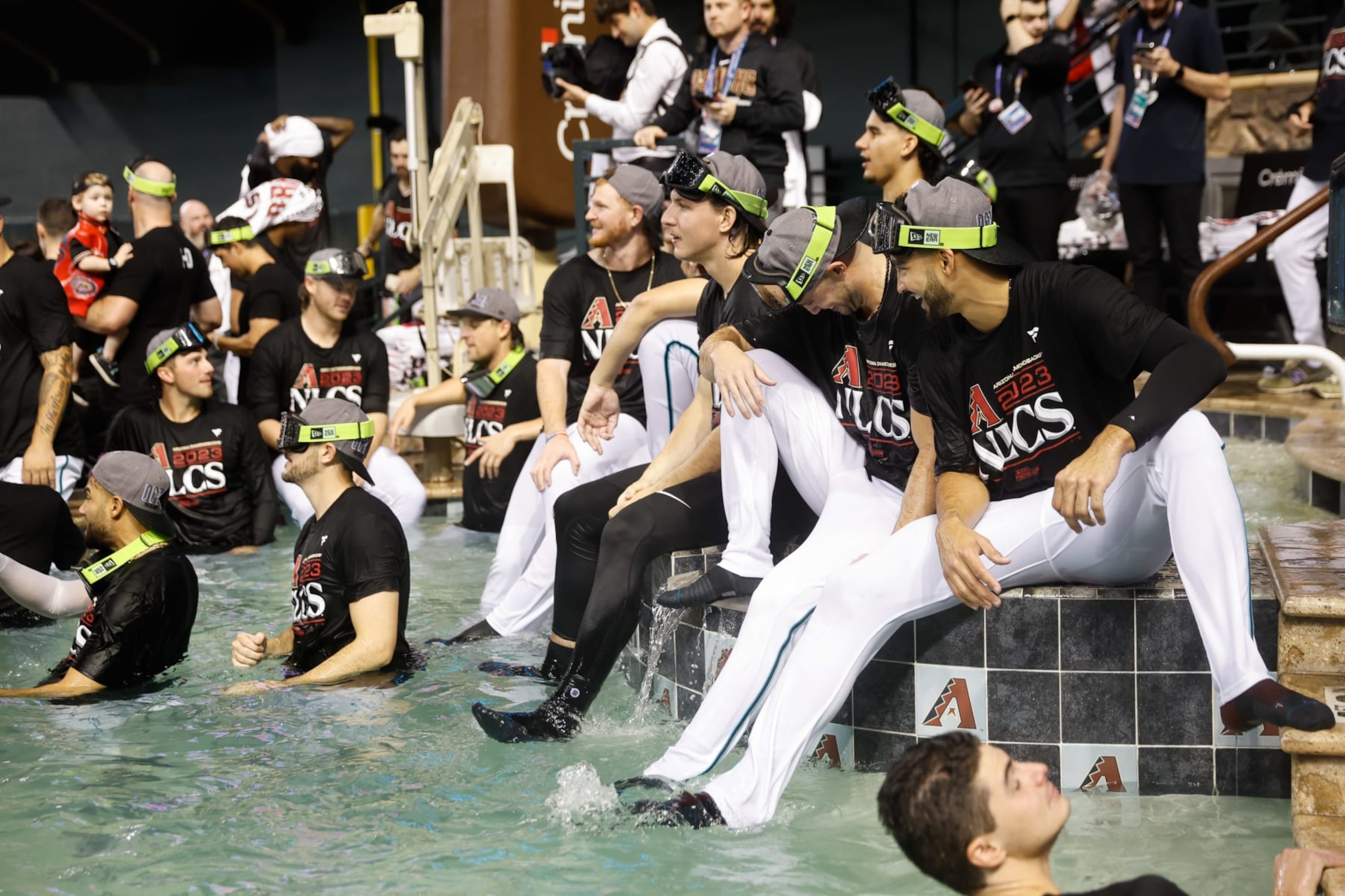 PHOENIX, AZ - OCTOBER 11:   Members of the Arizona Diamondbacks celebrate after defeating the Los Angeles Dodgers in Game 3 of the Division Series at Chase Field on Wednesday, October 11, 2023 in Phoenix, Arizona. The Diamondbacks defeated the Dodgers 4-2 to advance to the National League Championship Series. (Photo by Chris Coduto/MLB Photos via Getty Images)