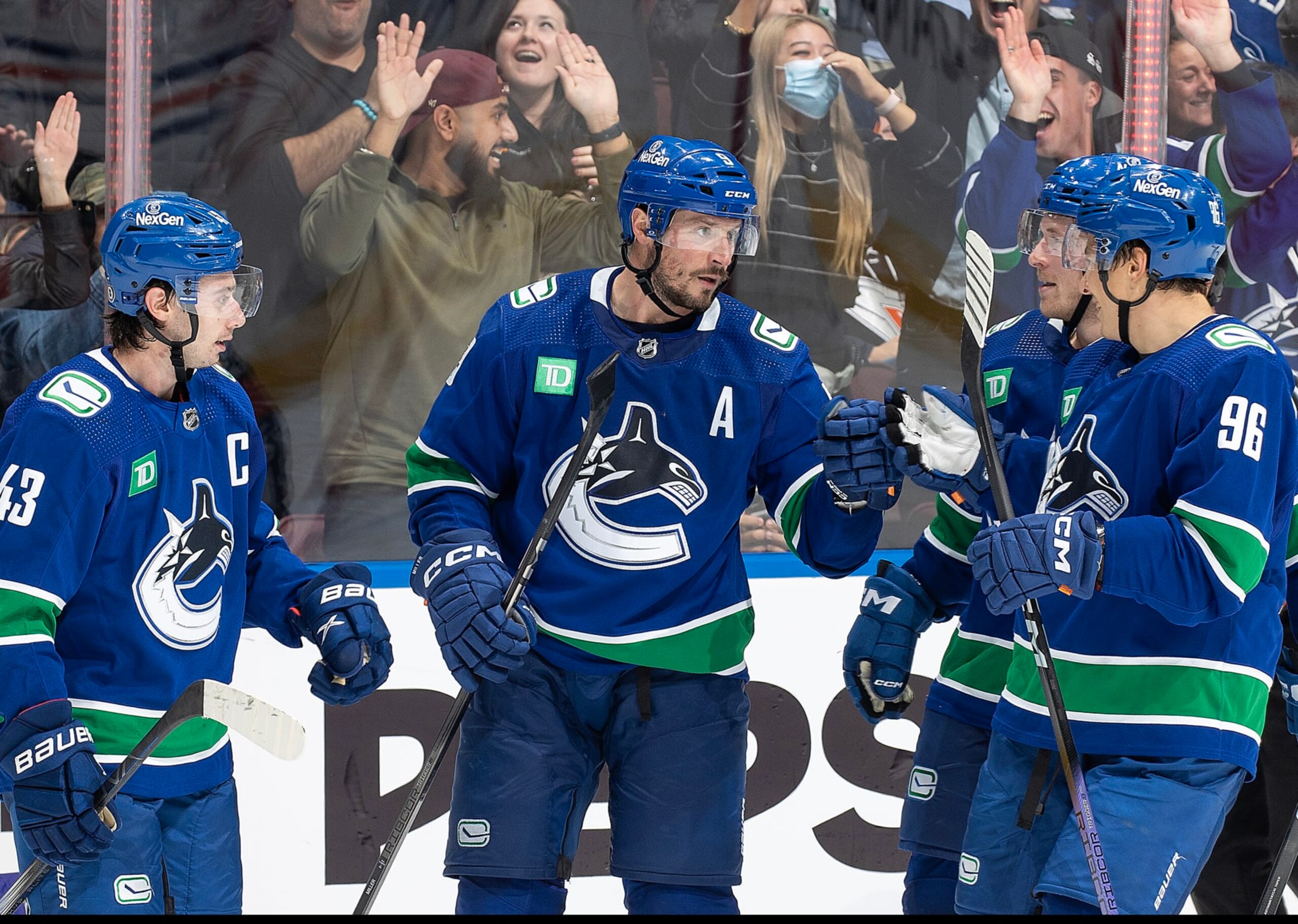 VANCOUVER, CANADA - OCTOBER 11: J.T. Miller #9 of the Vancouver Canucks celebrates his goal with teammates during the third period of their NHL game at Rogers Arena October 11, 2023 in Vancouver, British Columbia, Canada. (Photo by Jeff Vinnick/NHLI via Getty Images) VANCOUVER, CANADA - OCTOBER 11: J.T. Miller #9 of the Vancouver Canucks celebrates his goal with teammates during the third period of their NHL game at Rogers Arena October 11, 2023 in Vancouver, British Columbia, Canada. (Photo by Jeff Vinnick/NHLI via Getty Images)