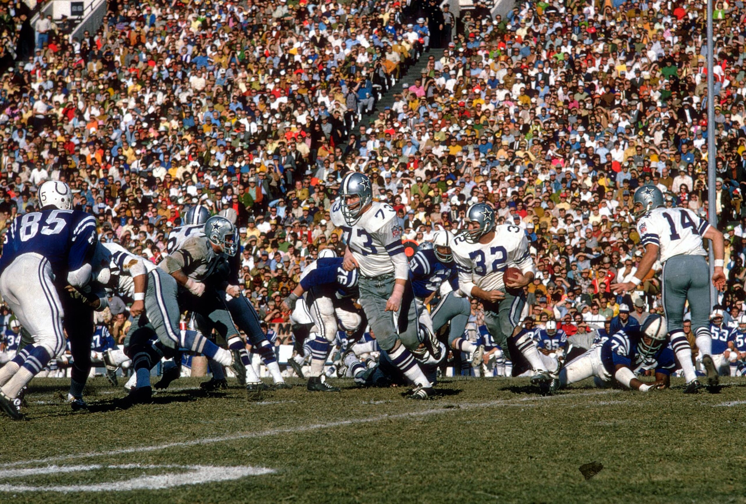 DALLAS, TX - DECEMBER 13:  Walt Garrison #32 of the Dallas Cowboys carries the ball against the Baltimore Colts during an NFL football game at the Cotton Bowl in Dallas Texas. Garrieson played for the Cowboys from 1966-74. (Photo by Focus on Sport/Getty Images) 