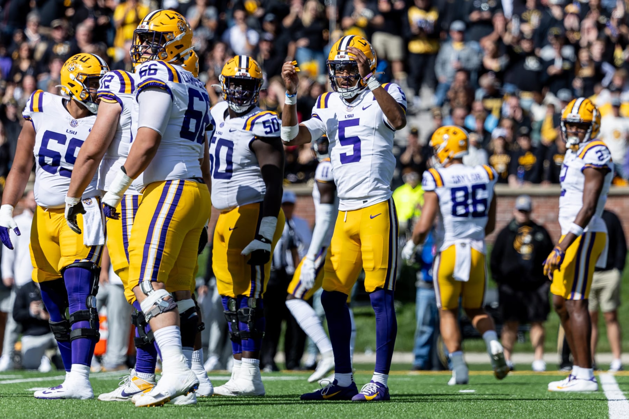 Jayden Daniels of the LSU Tigers looks to the sidelines. Jayden Daniels of the LSU Tigers looks to the sidelines.