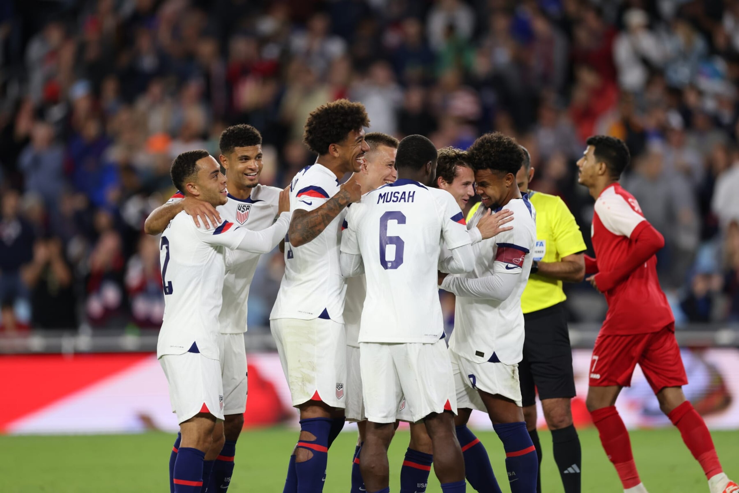 ST PAUL, MN - SEPTEMBER 12: Brenden Aaronson #11 of the United States celebrates scoring with teammates  during an international friendly game between Oman and USMNT at Allianz Field on September 12, 2023 in St Paul, Minnesota. (Photo by John Dorton/ISI Photos/Getty Images).