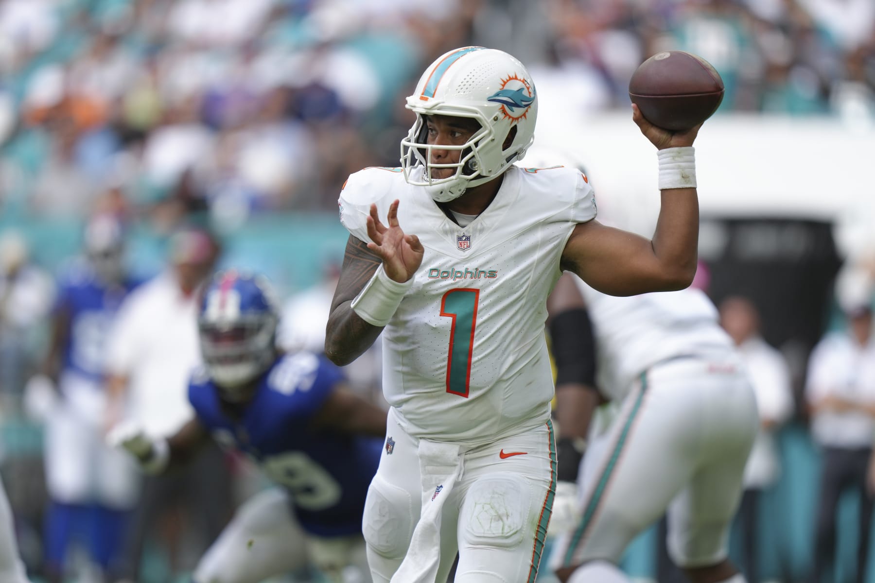 MIAMI GARDENS, FL - OCTOBER 08: Miami Dolphins quarterback Tua Tagovailoa (1) makes a pass attempt in the second half during the game between the New York Giants and the Miami Dolphins on Sunday, October 8, 2023 at Hard Rock Stadium, Miami Gardens, Fla. (Photo by Peter Joneleit/Icon Sportswire via Getty Images)