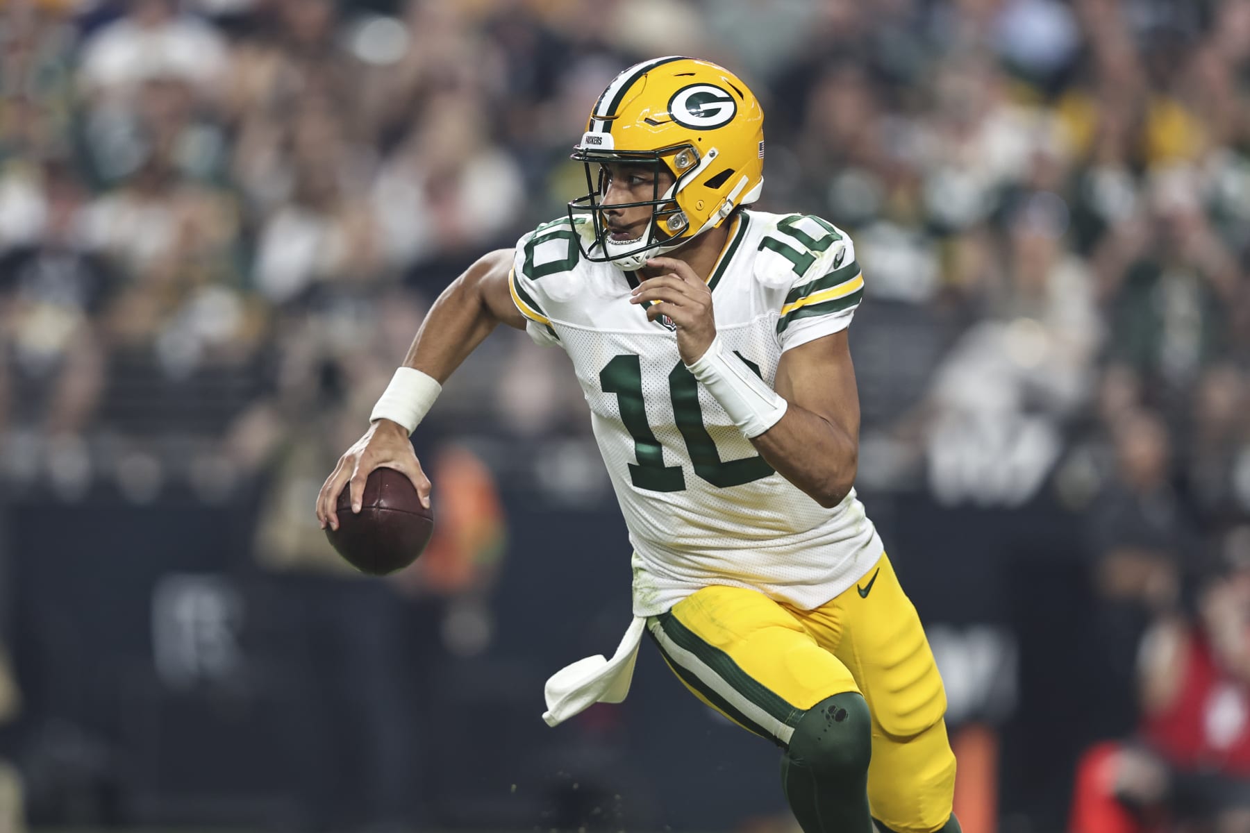 LAS VEGAS, NEVADA - OCTOBER 09: Jordan Love #10 of the Green Bay Packers scrambles and looks to pass during an NFL football game between the Las Vegas Raiders and the Green Bay Packers at Allegiant Stadium on October 09, 2023 in Las Vegas, Nevada. (Photo by Michael Owens/Getty Images)