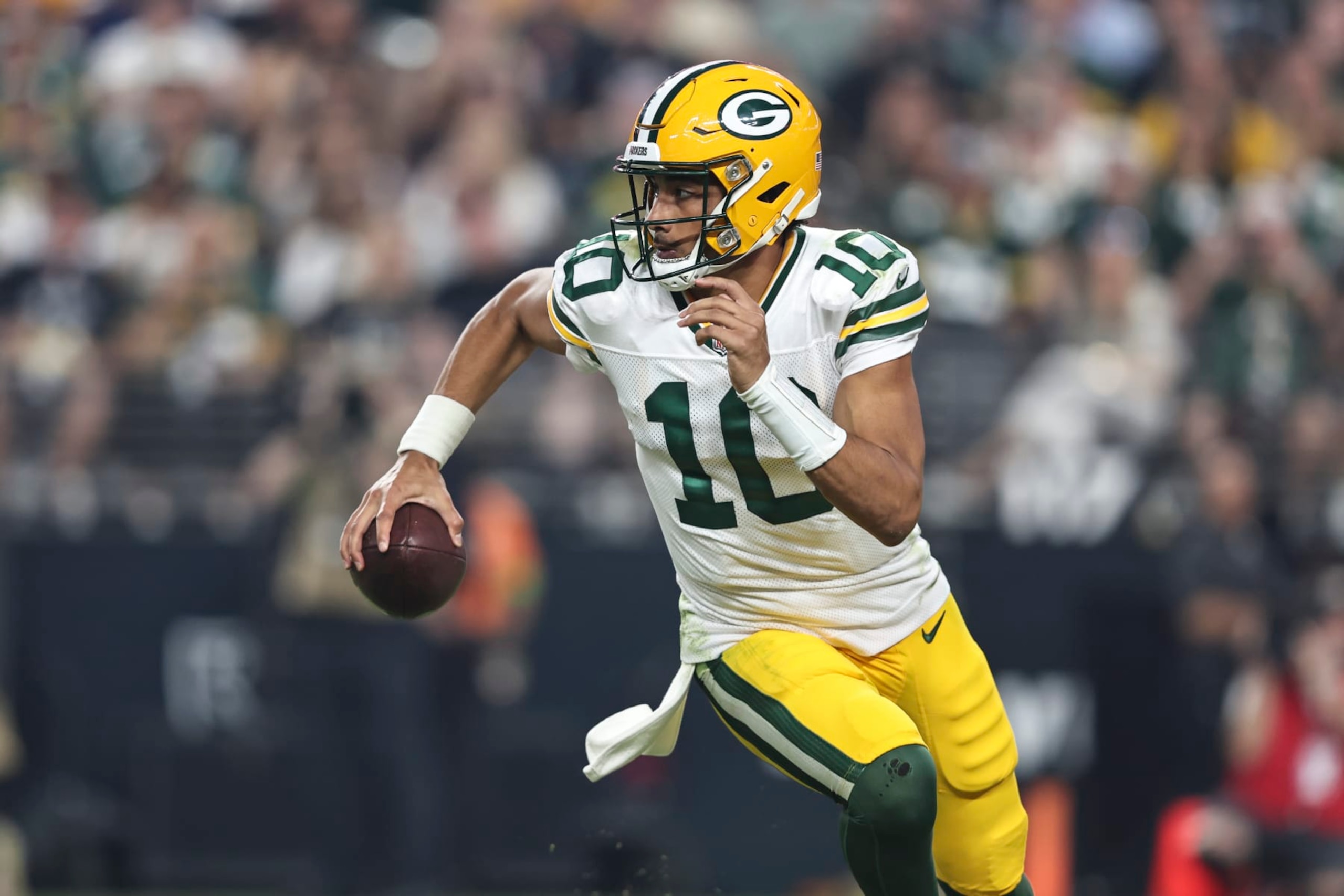 LAS VEGAS, NEVADA - OCTOBER 09: Jordan Love #10 of the Green Bay Packers scrambles and looks to pass during an NFL football game between the Las Vegas Raiders and the Green Bay Packers at Allegiant Stadium on October 09, 2023 in Las Vegas, Nevada. (Photo by Michael Owens/Getty Images) LAS VEGAS, NEVADA - OCTOBER 09: Jordan Love #10 of the Green Bay Packers scrambles and looks to pass during an NFL football game between the Las Vegas Raiders and the Green Bay Packers at Allegiant Stadium on October 09, 2023 in Las Vegas, Nevada. (Photo by Michael Owens/Getty Images)