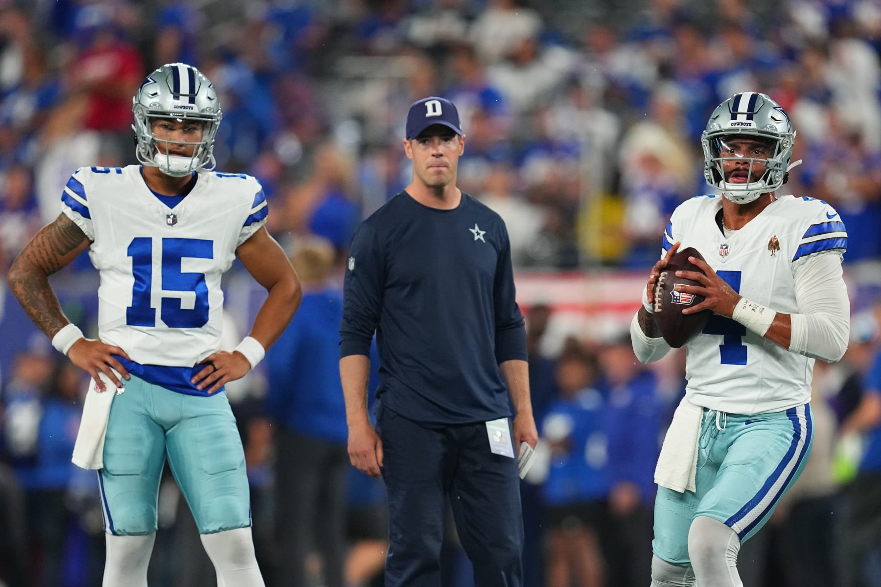 EAST RUTHERFORD, NEW JERSEY - SEPTEMBER 10: Dak Prescott #4 of the Dallas Cowboys warms up as Trey Lance #15 looks on against the New York Giants at MetLife Stadium on September 10, 2023 in East Rutherford, New Jersey. (Photo by Mitchell Leff/Getty Images)