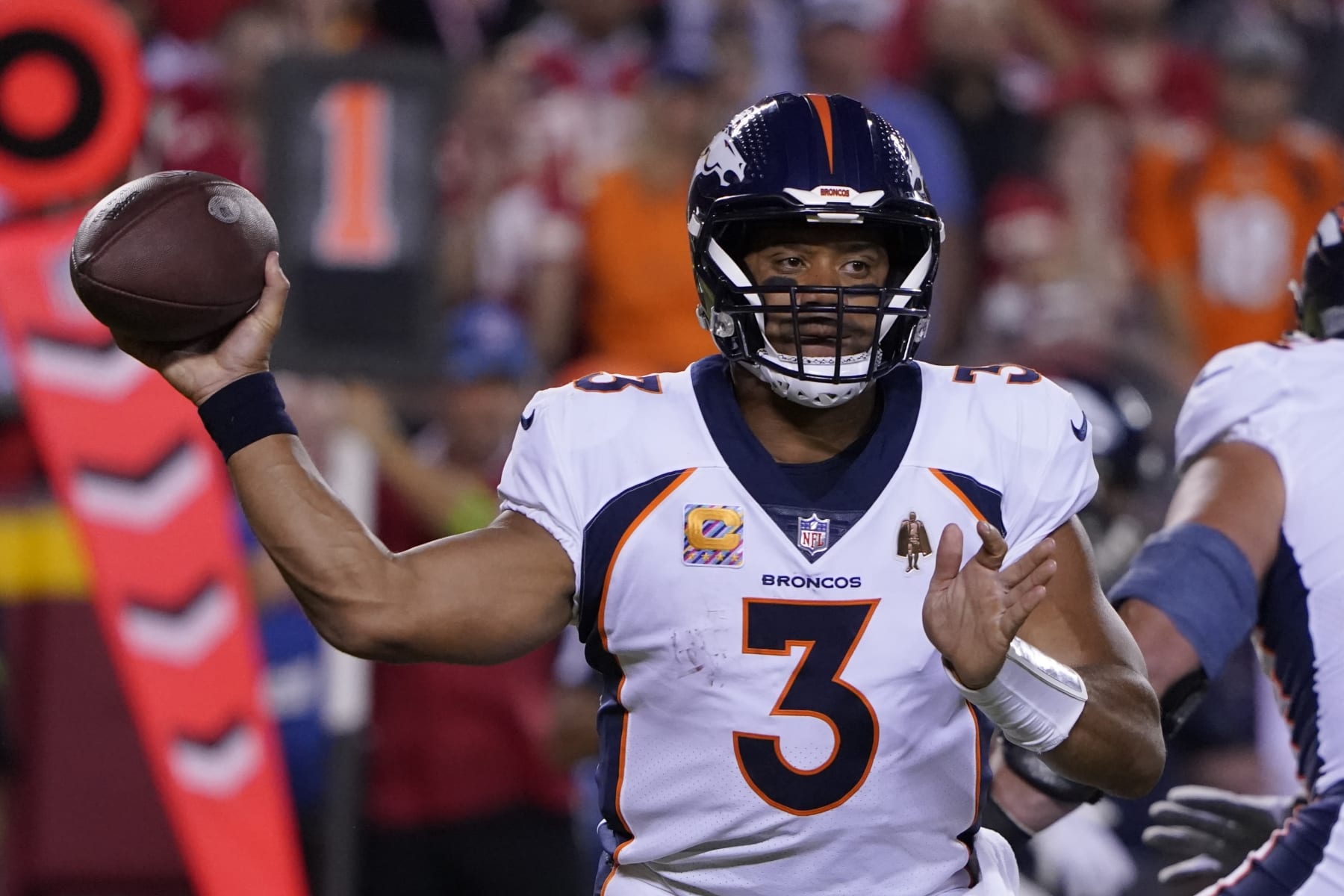 Denver Broncos quarterback Russell Wilson throws during the first half of an NFL football game against the Kansas City Chiefs, Thursday, Oct. 12, 2023, in Kansas City, Mo. (AP Photo/Ed Zurga)
