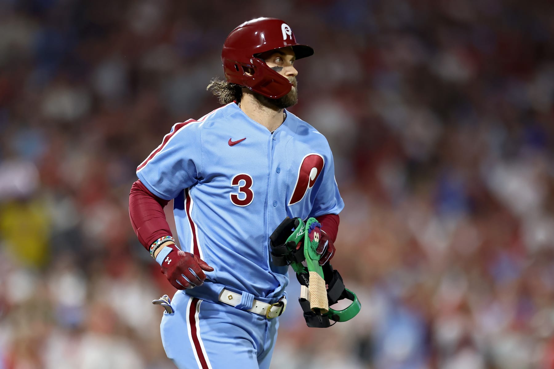 PHILADELPHIA, PENNSYLVANIA - OCTOBER 12: Bryce Harper #3 of the Philadelphia Phillies jogs to first base after being intentionally walked in the first inning against the Atlanta Braves during Game Four of the Division Series at Citizens Bank Park on October 12, 2023 in Philadelphia, Pennsylvania. (Photo by Tim Nwachukwu/Getty Images)