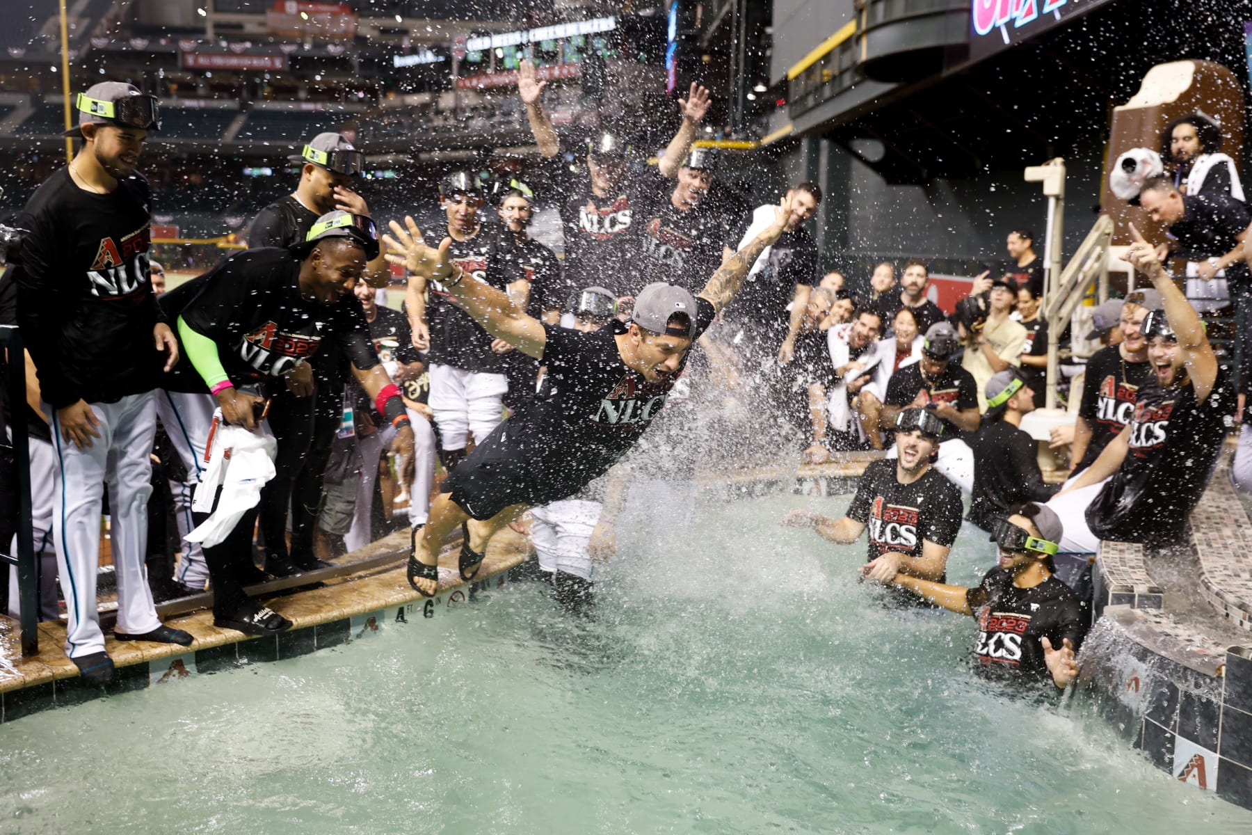 PHOENIX, AZ - OCTOBER 11: Members of the Arizona Diamondbacks celebrate after defeating the Los Angeles Dodgers in Game 3 of the Division Series at Chase Field on Wednesday, October 11, 2023 in Phoenix, Arizona. The Diamondbacks defeated the Dodgers 4-2 to advance to the National League Championship Series. (Photo by Chris Coduto/MLB Photos via Getty Images) PHOENIX, AZ - OCTOBER 11: Members of the Arizona Diamondbacks celebrate after defeating the Los Angeles Dodgers in Game 3 of the Division Series at Chase Field on Wednesday, October 11, 2023 in Phoenix, Arizona. The Diamondbacks defeated the Dodgers 4-2 to advance to the National League Championship Series. (Photo by Chris Coduto/MLB Photos via Getty Images)