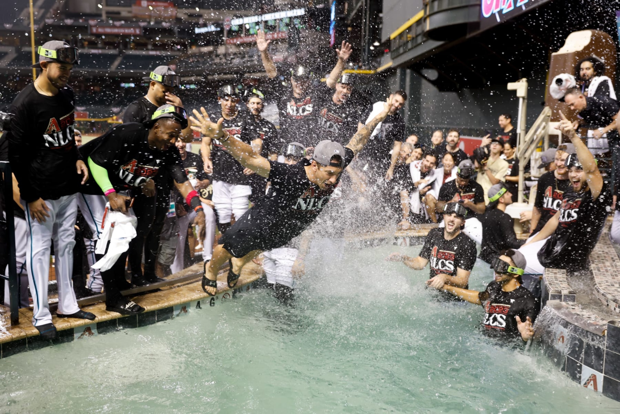 PHOENIX, AZ - OCTOBER 11:   Members of the Arizona Diamondbacks celebrate after defeating the Los Angeles Dodgers in Game 3 of the Division Series at Chase Field on Wednesday, October 11, 2023 in Phoenix, Arizona. The Diamondbacks defeated the Dodgers 4-2 to advance to the National League Championship Series. (Photo by Chris Coduto/MLB Photos via Getty Images)
