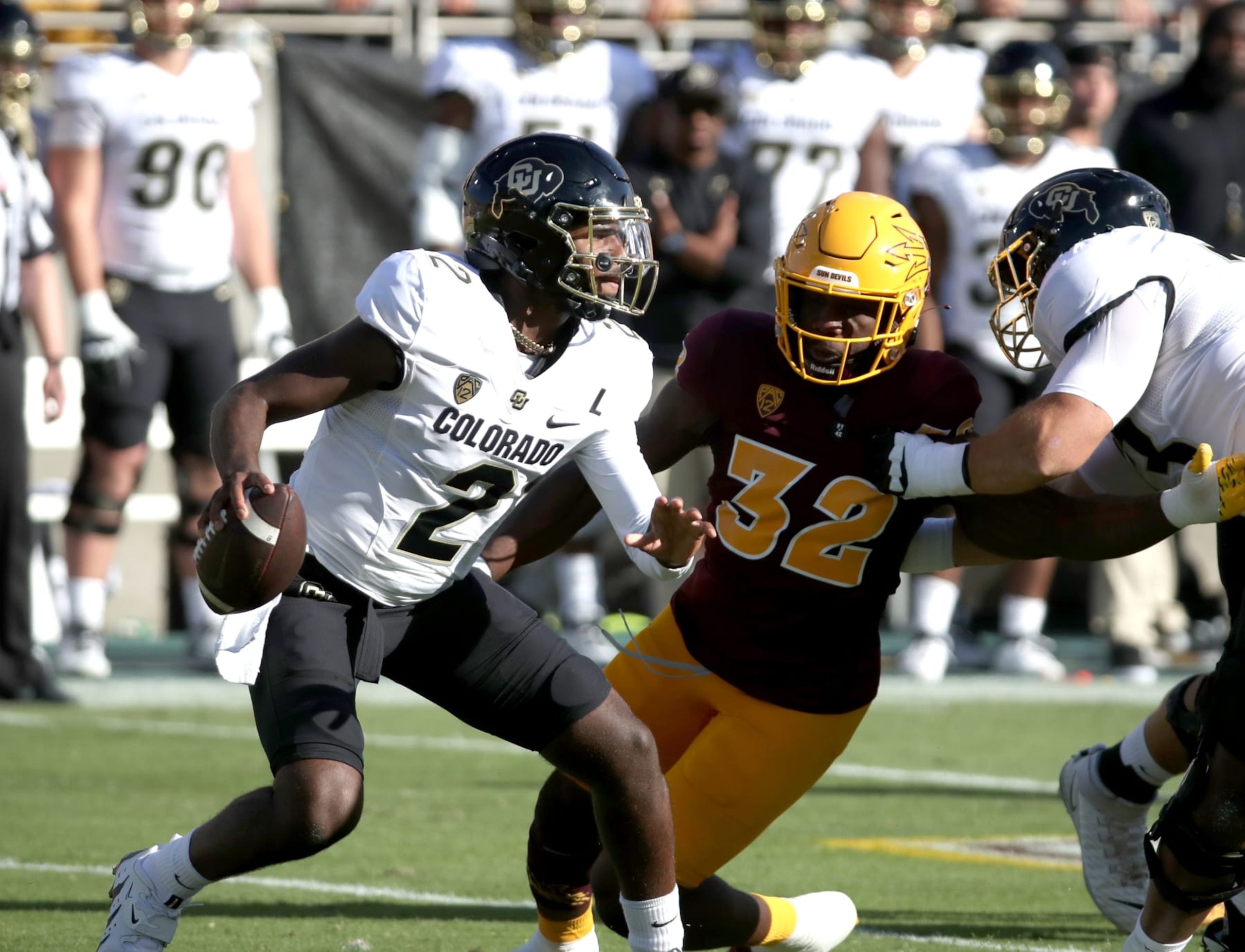 TEMPE, ARIZONA - OCTOBER 7: Shedeur Sanders #2 of the University of Colorado Buffs tries to evade defender Prince Dorbah #32 of the Arizona State Sun Devils in the first quarter against the Arizona State Sun Devils at Mountain America Stadium on October 7, 2023 in Tempe, Arizona. (Photo by Bruce Yeung/Getty Images) TEMPE, ARIZONA - OCTOBER 7: Shedeur Sanders #2 of the University of Colorado Buffs tries to evade defender Prince Dorbah #32 of the Arizona State Sun Devils in the first quarter against the Arizona State Sun Devils at Mountain America Stadium on October 7, 2023 in Tempe, Arizona. (Photo by Bruce Yeung/Getty Images)