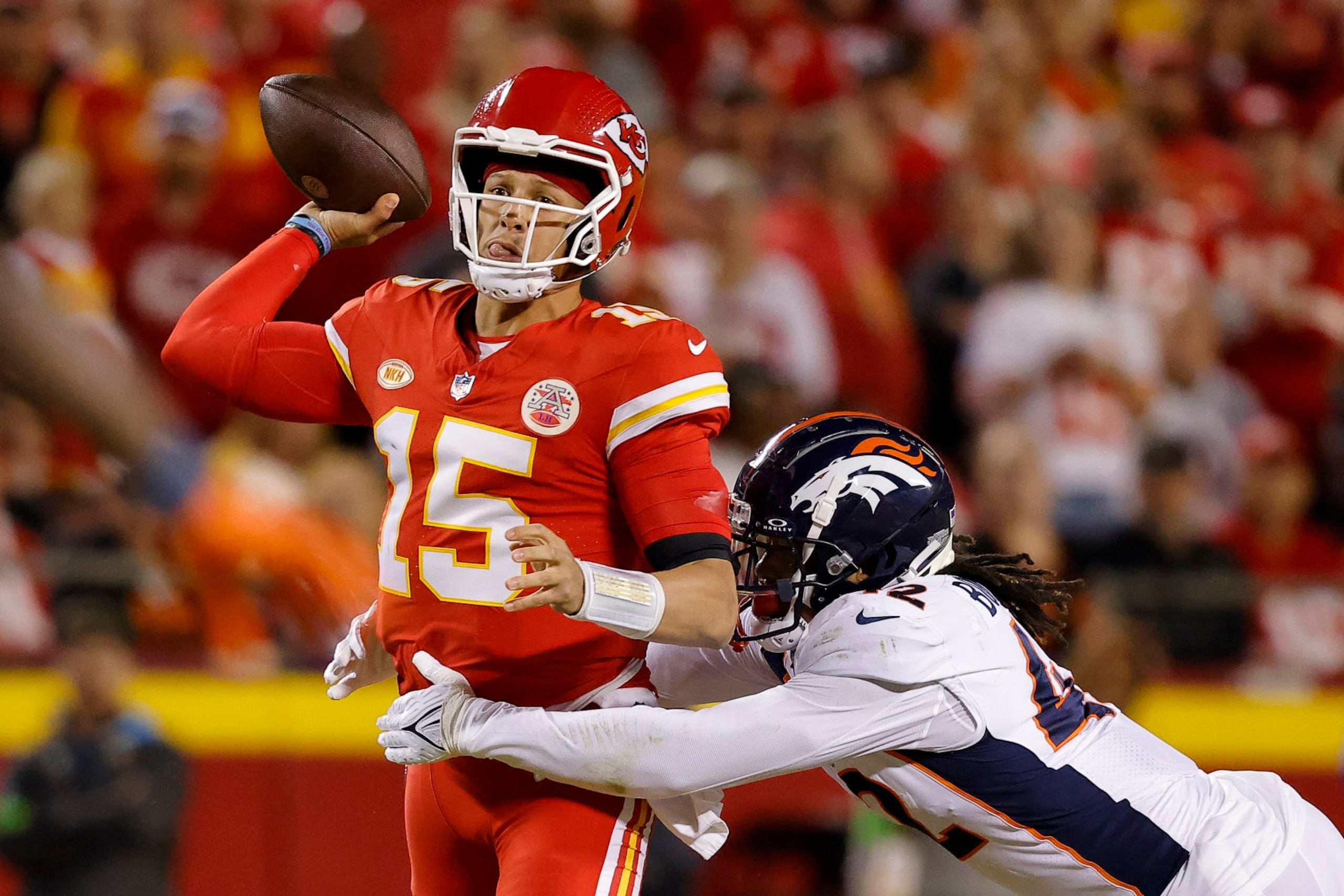 KANSAS CITY, MISSOURI - OCTOBER 12: Nik Bonitto #42 of the Denver Broncos pressures Patrick Mahomes #15 of the Kansas City Chiefs during the second quarter at GEHA Field at Arrowhead Stadium on October 12, 2023 in Kansas City, Missouri. (Photo by David Eulitt/Getty Images) KANSAS CITY, MISSOURI - OCTOBER 12: Nik Bonitto #42 of the Denver Broncos pressures Patrick Mahomes #15 of the Kansas City Chiefs during the second quarter at GEHA Field at Arrowhead Stadium on October 12, 2023 in Kansas City, Missouri. (Photo by David Eulitt/Getty Images)