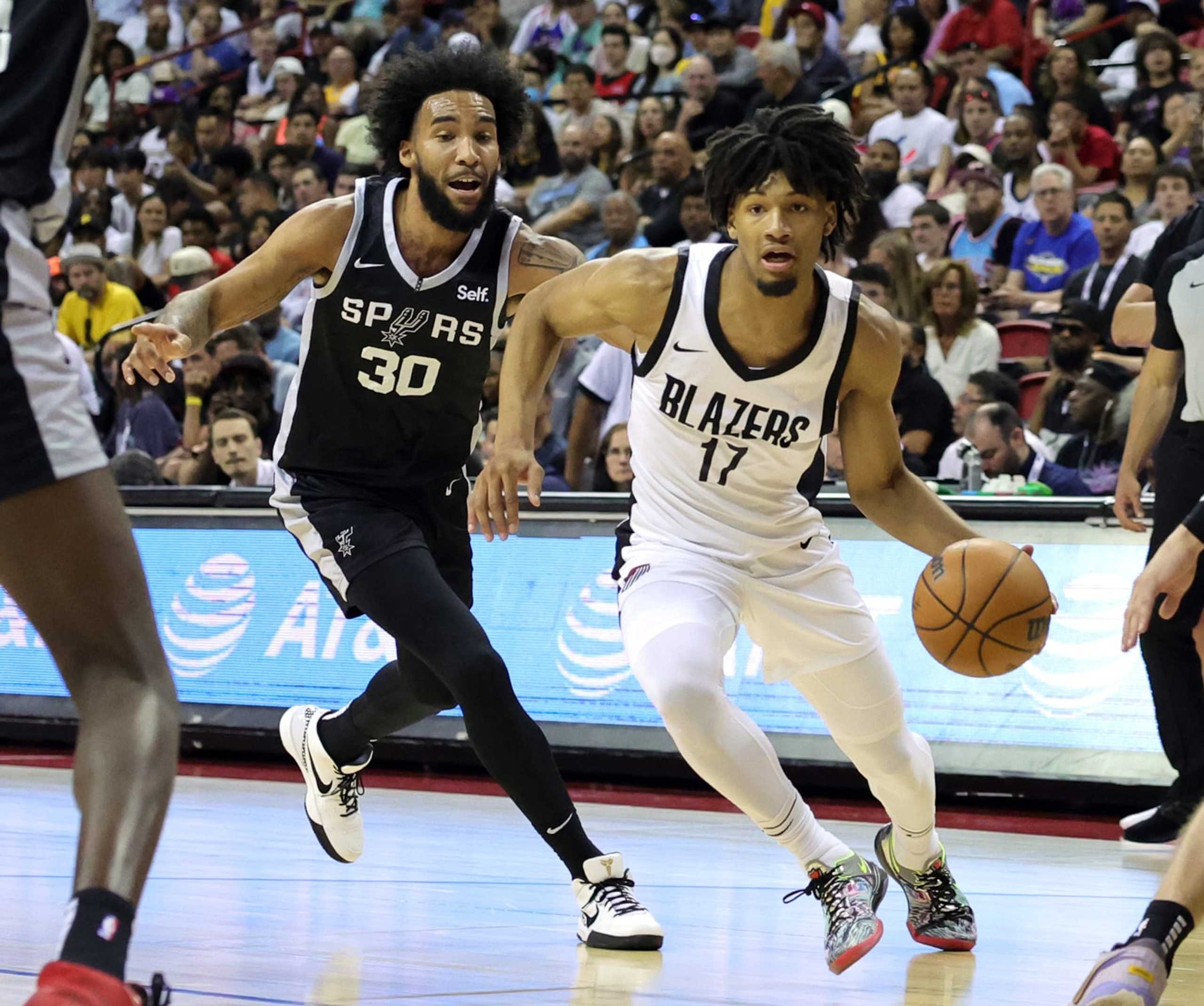 LAS VEGAS, NEVADA - JULY 09: Shaedon Sharpe #17 of the Portland Trail Blazers drives against Julian Champagnie #30 of the San Antonio Spurs in the first half of a 2023 NBA Summer League game at the Thomas & Mack Center on July 09, 2023 in Las Vegas, Nevada. NOTE TO USER: User expressly acknowledges and agrees that, by downloading and or using this photograph, User is consenting to the terms and conditions of the Getty Images License Agreement. (Photo by Ethan Miller/Getty Images)