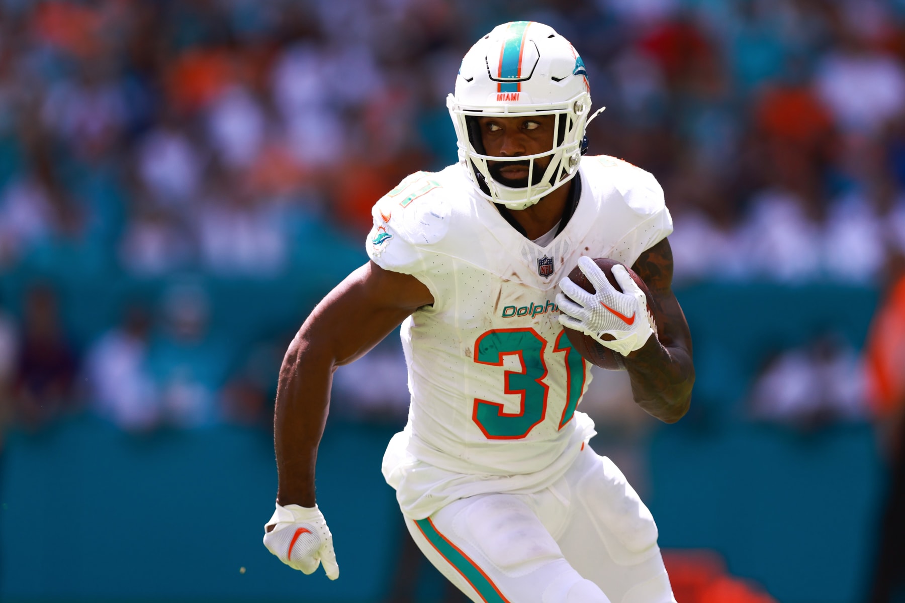 MIAMI GARDENS, FLORIDA - SEPTEMBER 24: Raheem Mostert #31 of the Miami Dolphins carries the ball against the Denver Broncos during the first half at Hard Rock Stadium on September 24, 2023 in Miami Gardens, Florida. (Photo by Megan Briggs/Getty Images)