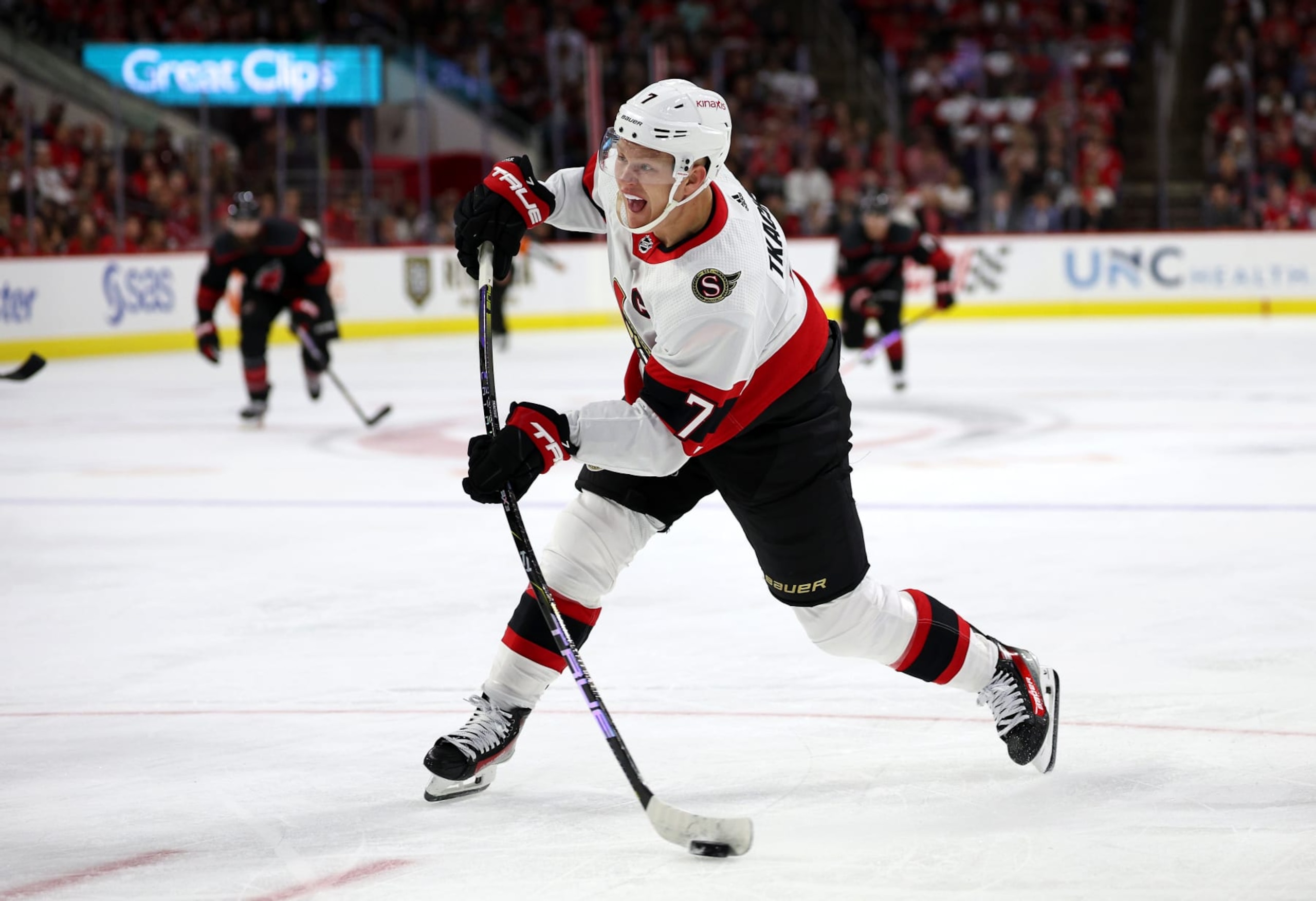 RALEIGH, NORTH CAROLINA - OCTOBER 11: Brady Tkachuk #7 of the Ottawa Senators attempts a shot during the first period of their game against the Carolina Hurricanesat PNC Arena on October 11, 2023 in Raleigh, North Carolina. (Photo by Jared C. Tilton/Getty Images)