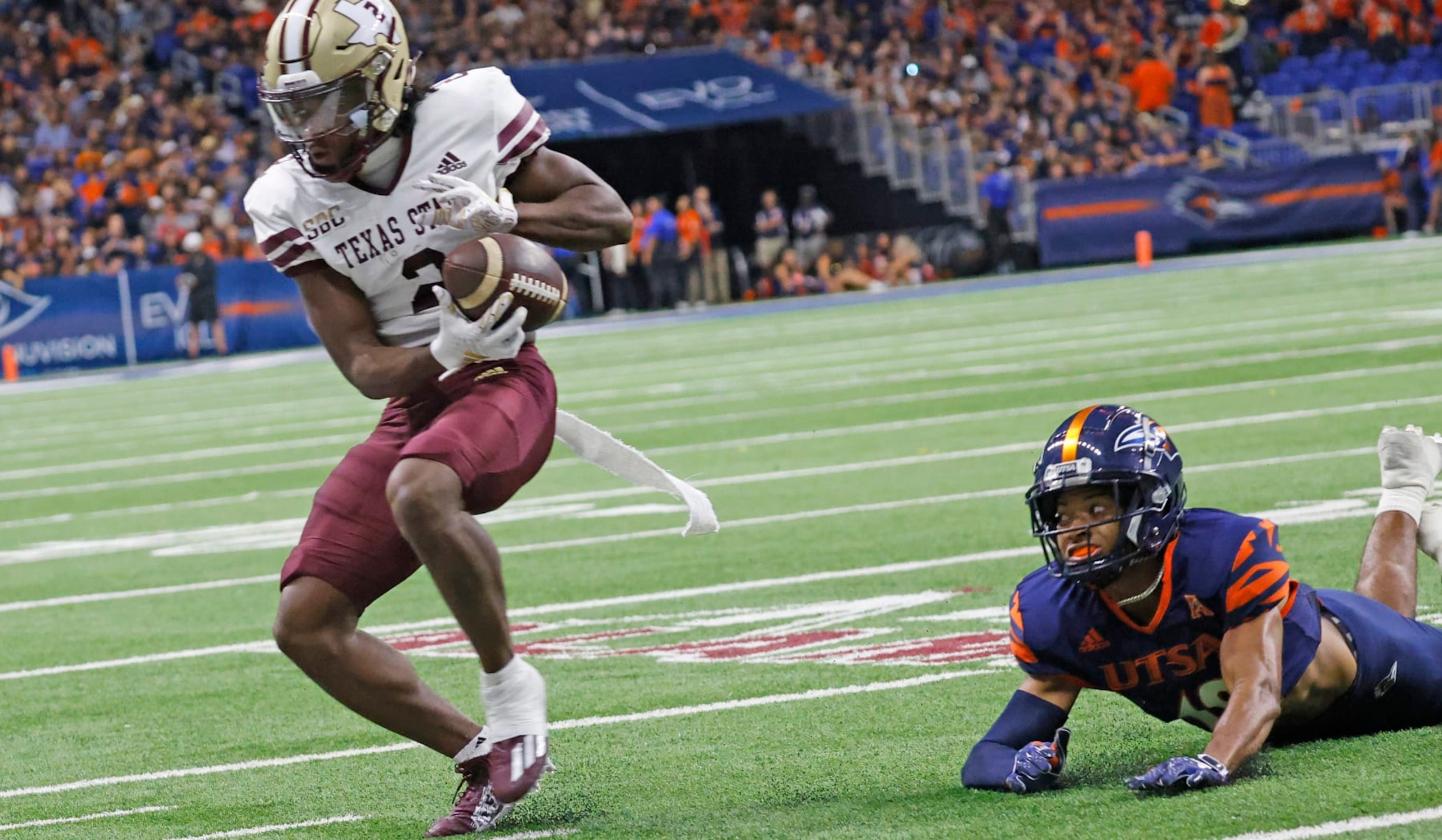 SAN ANTONIO, TX - SEPTEMBER 9: Kole Wilson #2  of the Texas State Bobcats catches a pass against the UTSA Roadrunners at the Alamodome on September 9,  2023 in San Antonio, Texas.  (Photo by Ronald Cortes/Getty Images)