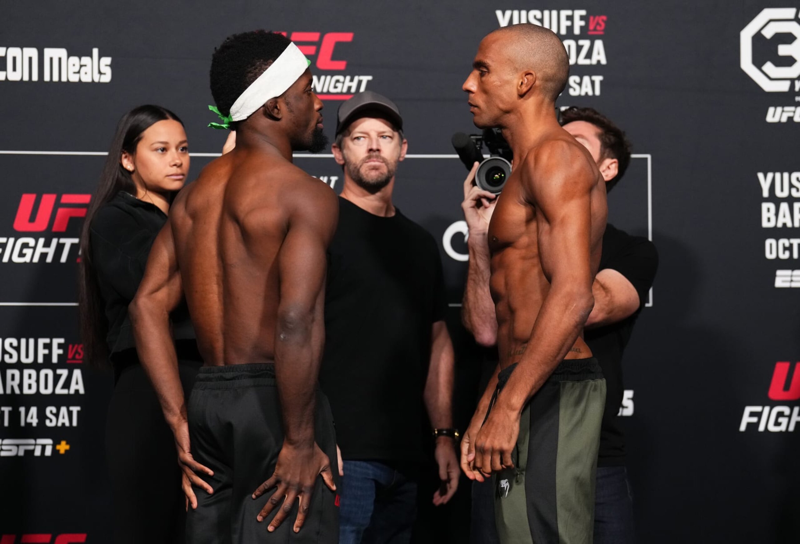 Sodiq Yusuff (left) and Edson Barboza face off before their featherweight fight. 