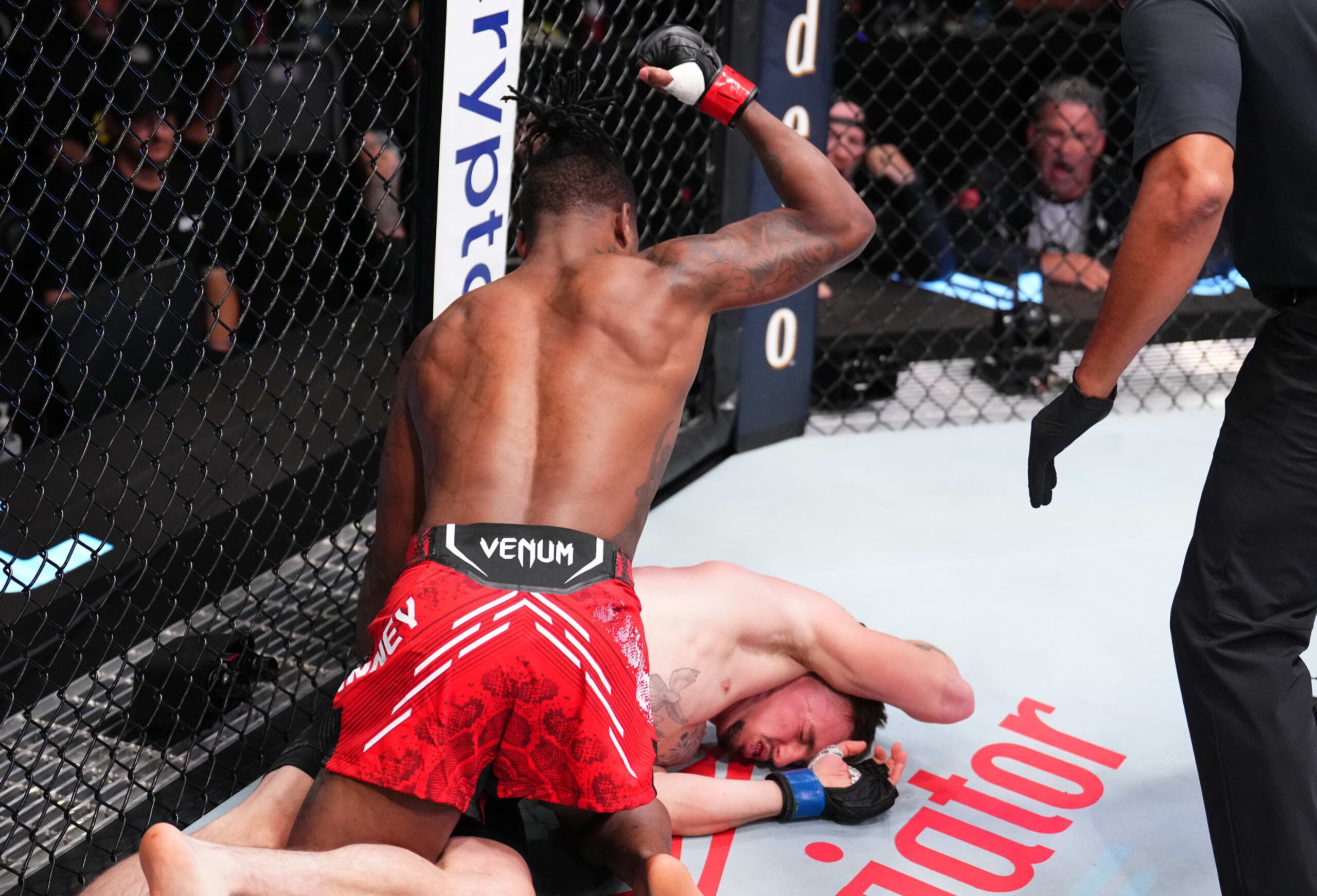 LAS VEGAS, NEVADA - OCTOBER 14: (L-R) Terrance McKinney knocks out Brendon Marotte in a lightweight fight during the UFC Fight Night event at UFC APEX on October 14, 2023 in Las Vegas, Nevada. (Photo by Chris Unger/Zuffa LLC via Getty Images)