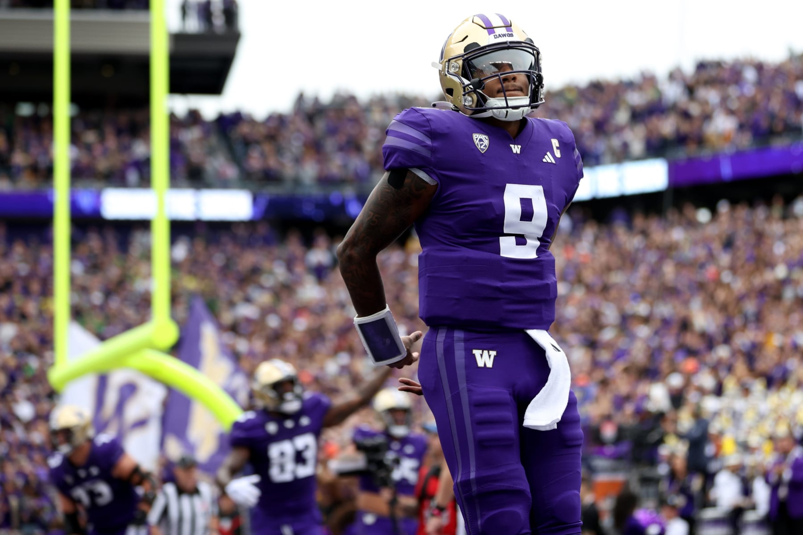 SEATTLE, WASHINGTON - OCTOBER 14: Michael Penix Jr. #9 of the Washington Huskies celebrates a touchdown against the Oregon Ducks during the first quarter at Husky Stadium on October 14, 2023 in Seattle, Washington. (Photo by Steph Chambers/Getty Images)