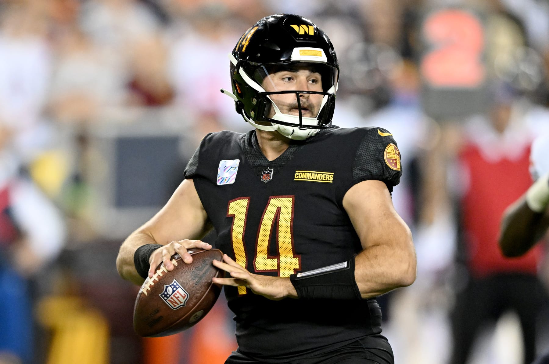 LANDOVER, MARYLAND - OCTOBER 05: Sam Howell #14 of the Washington Commanders drops back to pass against the Chicago Bears at FedExField on October 05, 2023 in Landover, Maryland. (Photo by G Fiume/Getty Images)