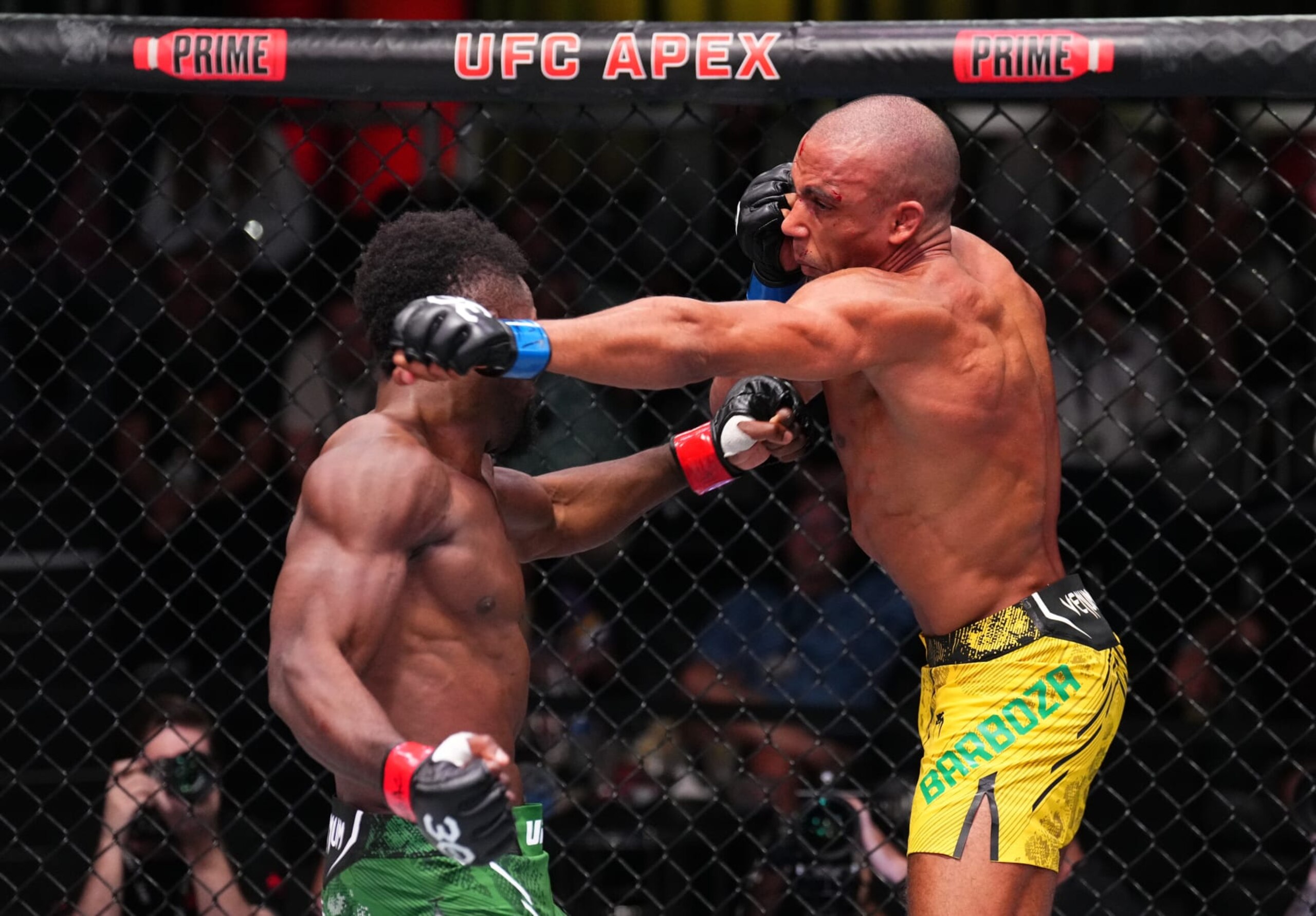 LAS VEGAS, NEVADA - OCTOBER 14: (R-L) Edson Barboza of Brazil and Sodiq Yusuff of Nigeria trade punches in a featherweight fight during the UFC Fight Night event at UFC APEX on October 14, 2023 in Las Vegas, Nevada. (Photo by Chris Unger/Zuffa LLC via Getty Images)