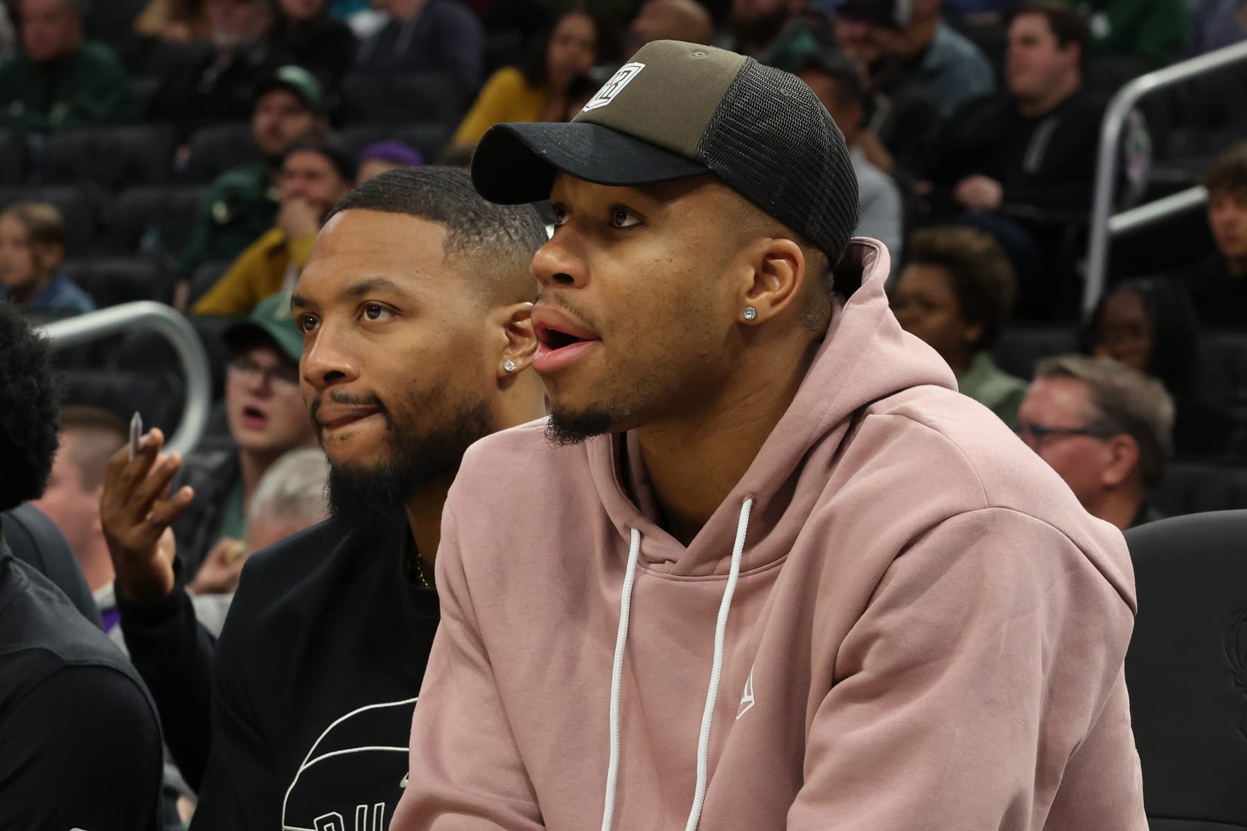 MILWAUKEE, WISCONSIN - OCTOBER 08: Damian Lillard #0 and Giannis Antetokounmpo #34 of the Milwaukee Bucks watch action during the first half of a game of a preseason game against the Chicago Bulls at Fiserv Forum on October 08, 2023 in Milwaukee, Wisconsin. NOTE TO USER: User expressly acknowledges and agrees that, by downloading and or using this photograph, User is consenting to the terms and conditions of the Getty Images License Agreement. (Photo by Stacy Revere/Getty Images)
