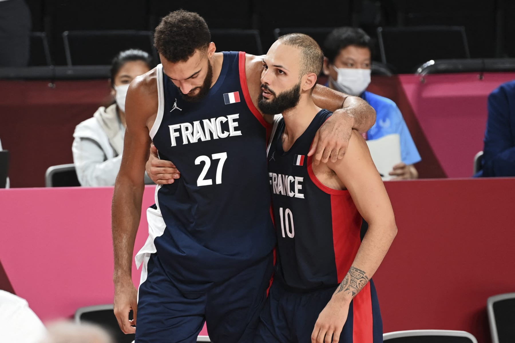 France's Rudy Gobert (L) reacts next to teammate Evan Fournier after France's defeat in the men's final basketball match between France and USA during the Tokyo 2020 Olympic Games at the Saitama Super Arena in Saitama on August 7, 2021. (Photo by Mohd RASFAN / AFP) (Photo by MOHD RASFAN/AFP via Getty Images)