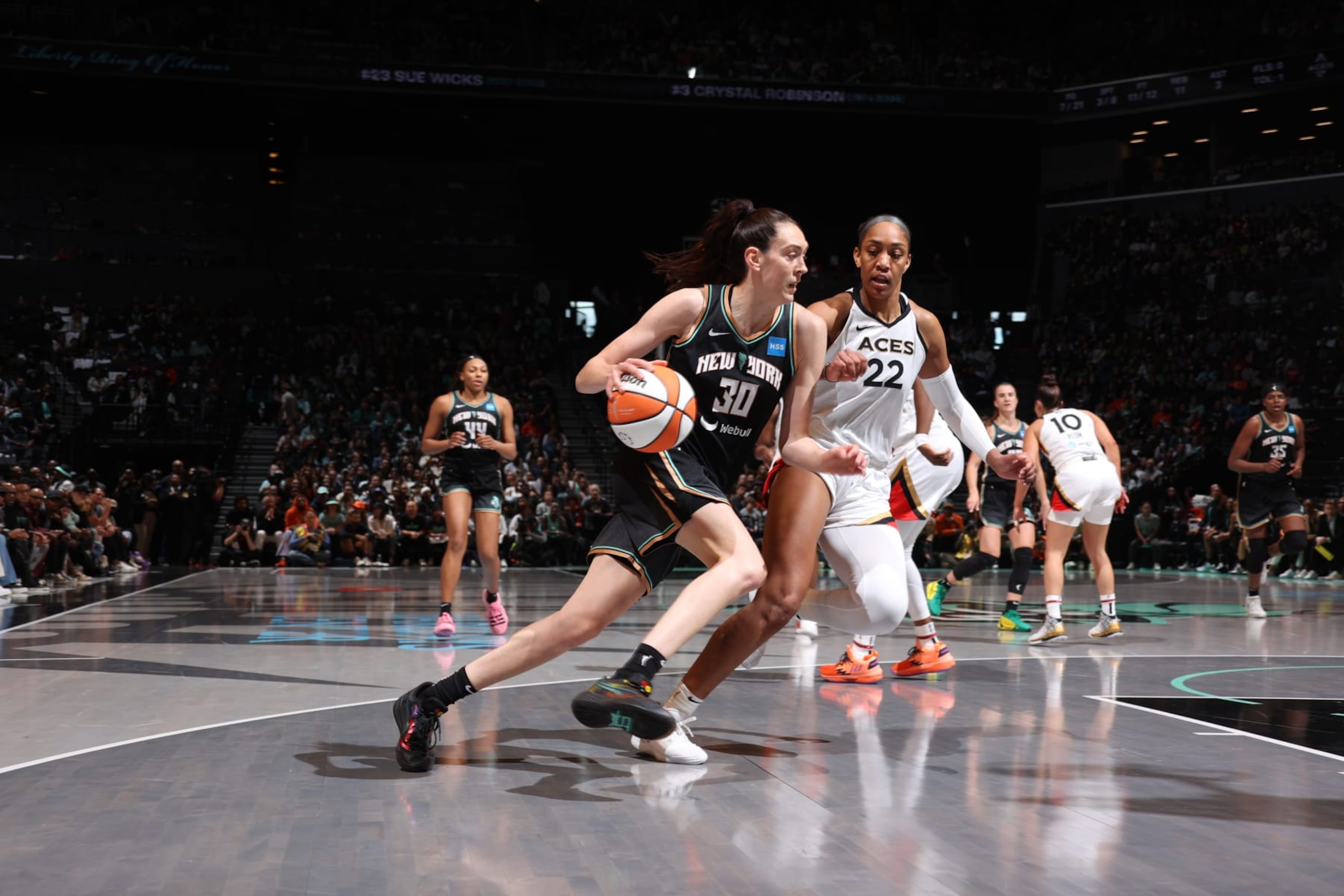 BROOKLYN, NY - OCTOBER 15: Breanna Stewart #30 of the New York Liberty drives to the basket against defender A'ja Wilson #22 of the Las Vegas Aces during Game 3 of the 2023 WNBA Finals on October 15, 2023 at Barclays Center in Brooklyn, New York. NOTE TO USER: User expressly acknowledges and agrees that, by downloading and or using this photograph, user is consenting to the terms and conditions of the Getty Images License Agreement. Mandatory Copyright Notice: Copyright 2023 NBAE (Photo by Stephen Gosling/NBAE via Getty Images)